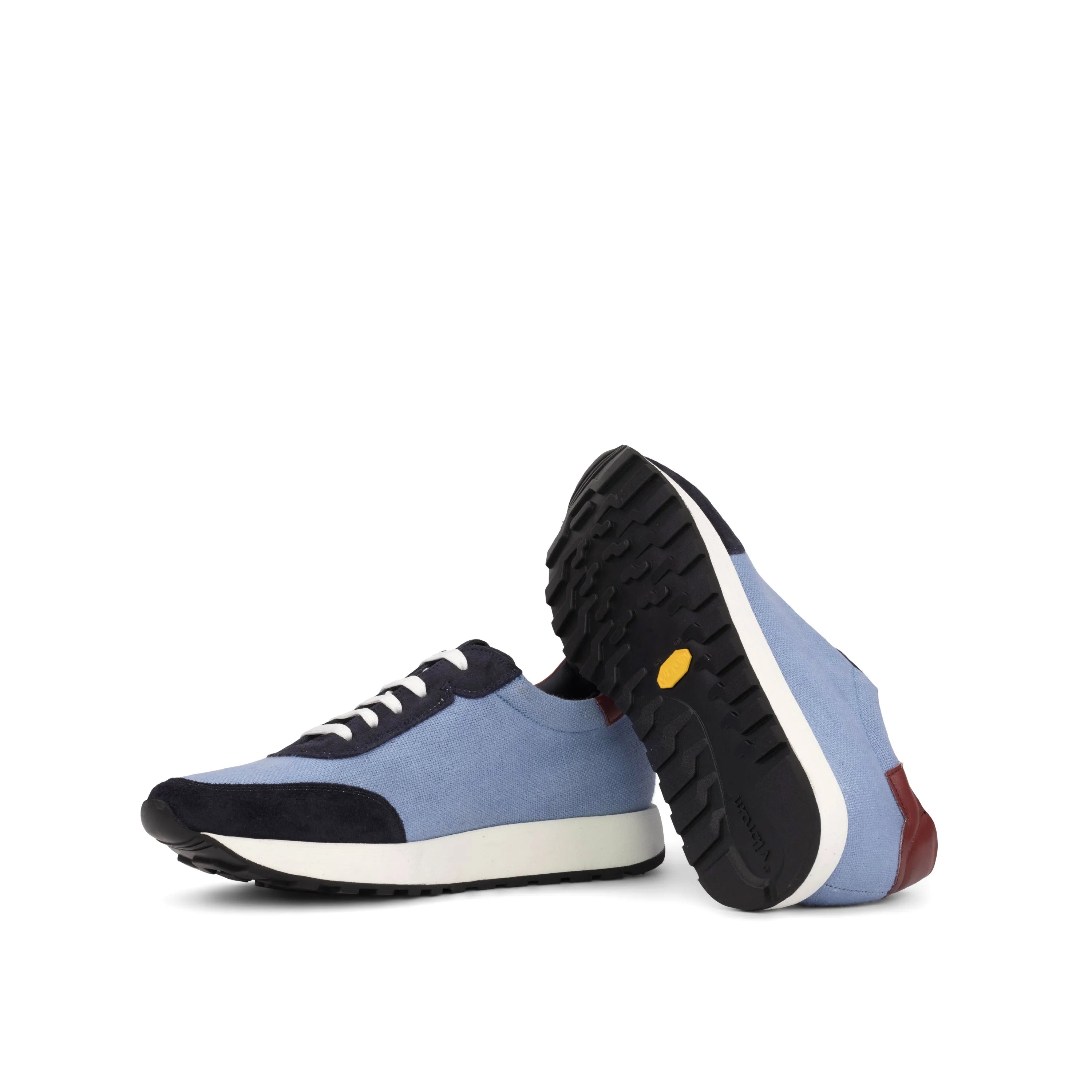 Pair of blue and black Endalos Geneva Sneakers II displayed stylishly on a surface