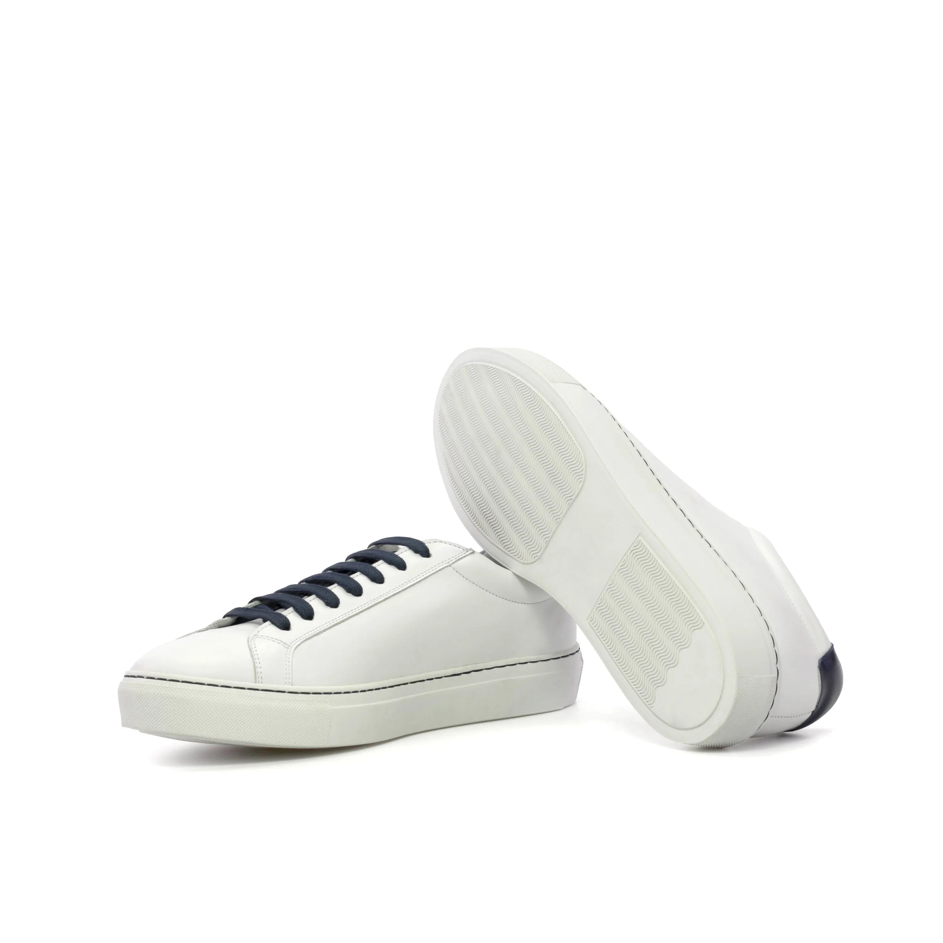 White calf leather Explorer Low Kick Sneakers featuring navy laces for a stylish look