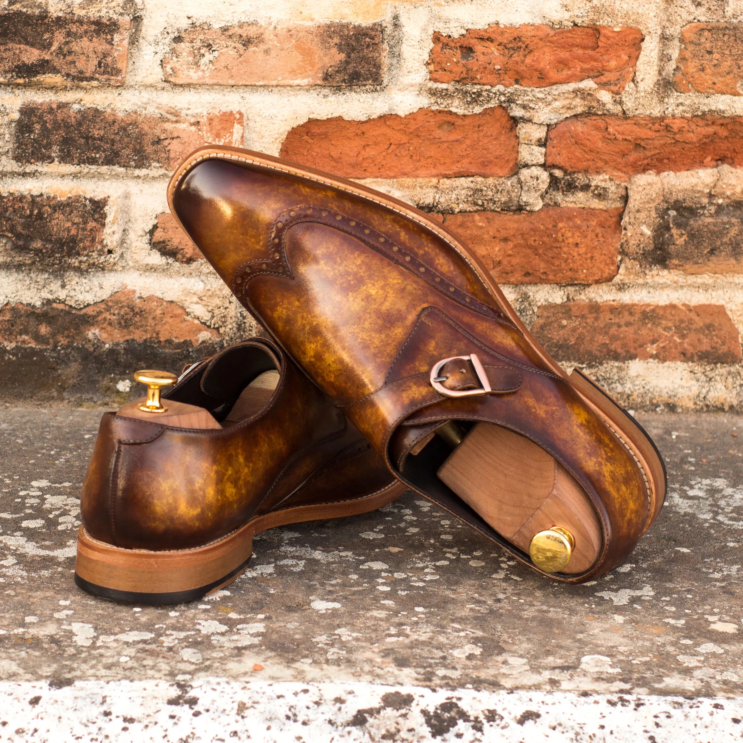 Brown leather patina single monk shoes showcasing elegant style and craftsmanship
