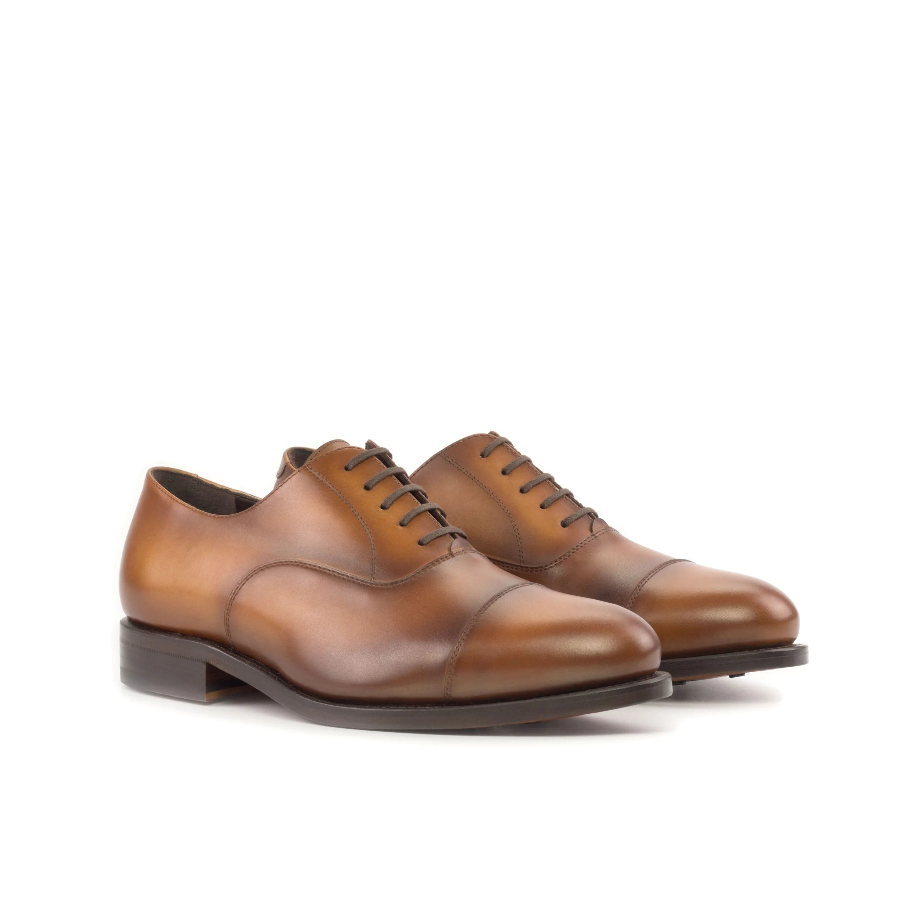 Brown leather dress shoes from the Founder Oxford collection for a sophisticated look