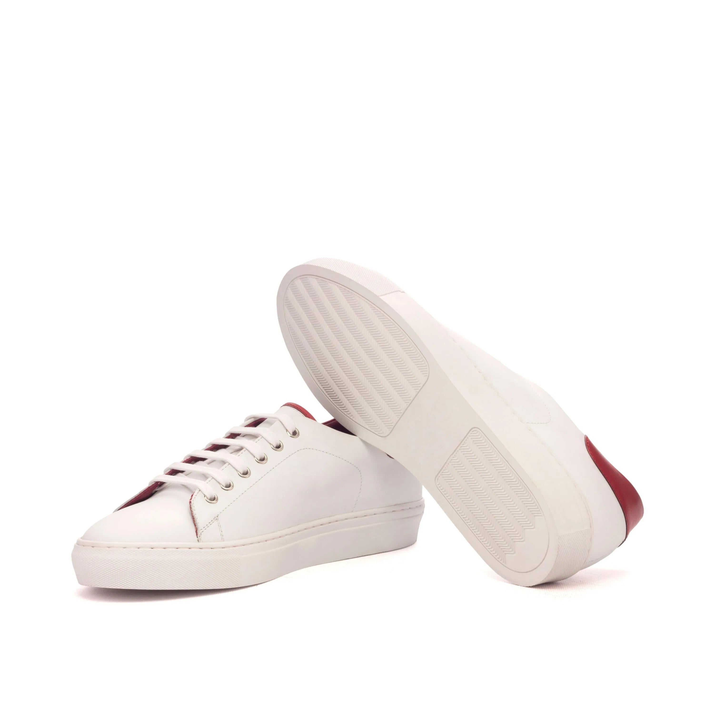 White leather Fridays Trainer Sneakers II with red accents for a stylish look