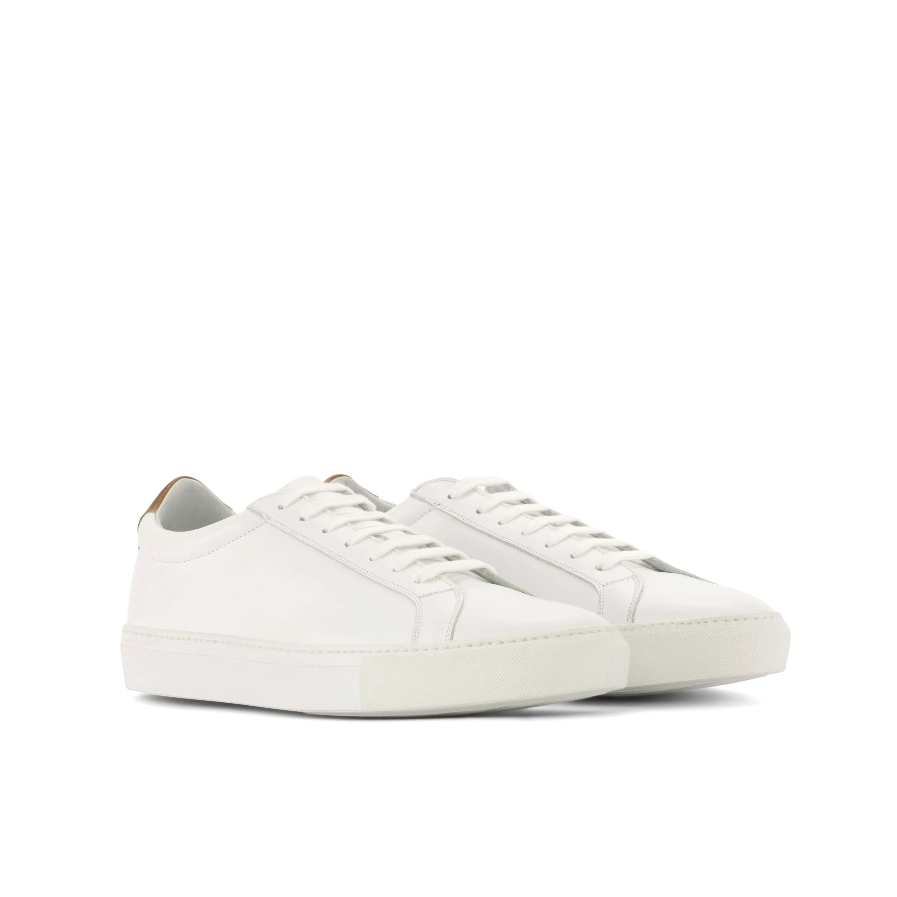 Pair of white leather Garry Low Kick Sneakers in a stylish fast lane design