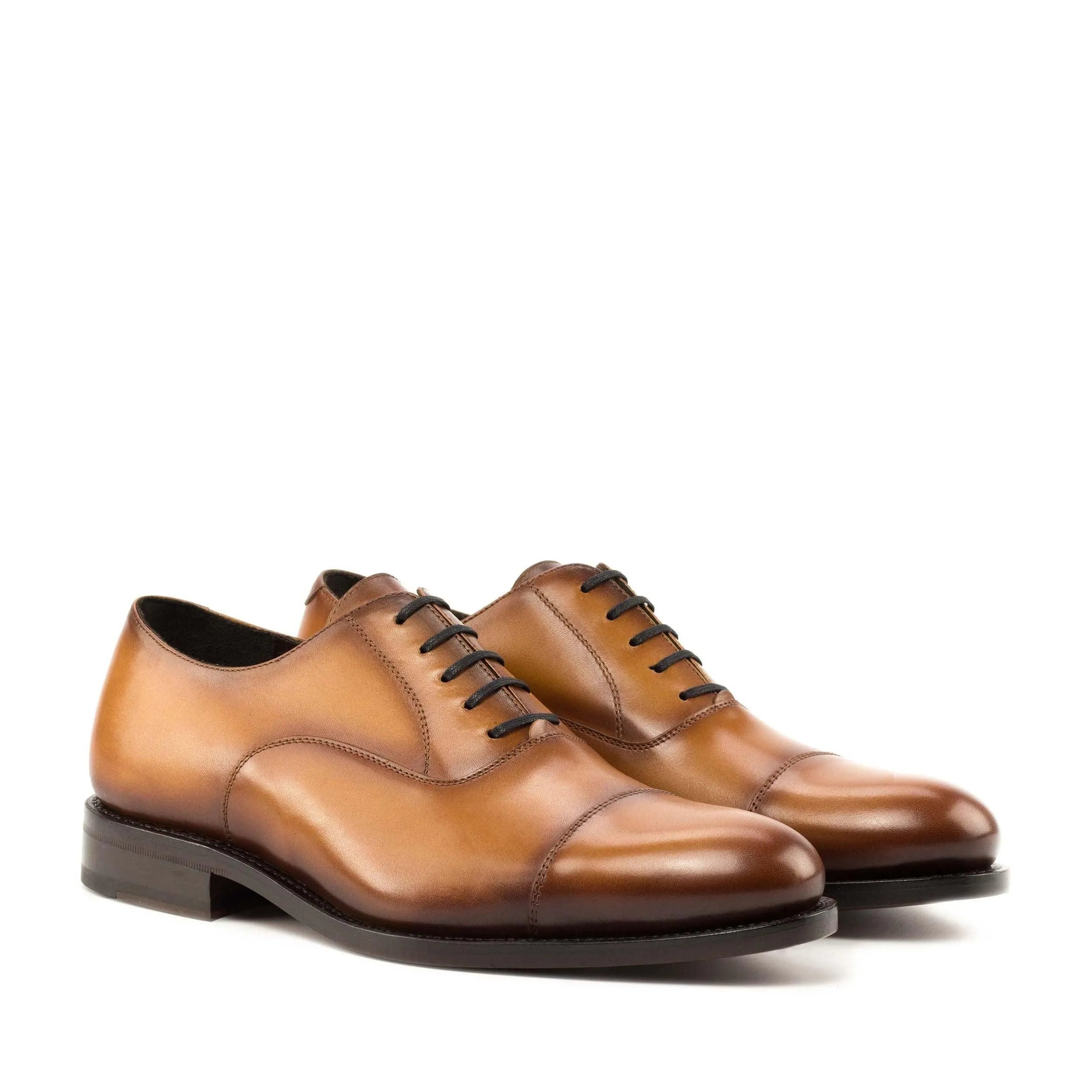 Brown leather Georgy Oxford shoes displayed elegantly, perfect for the fast lane lifestyle