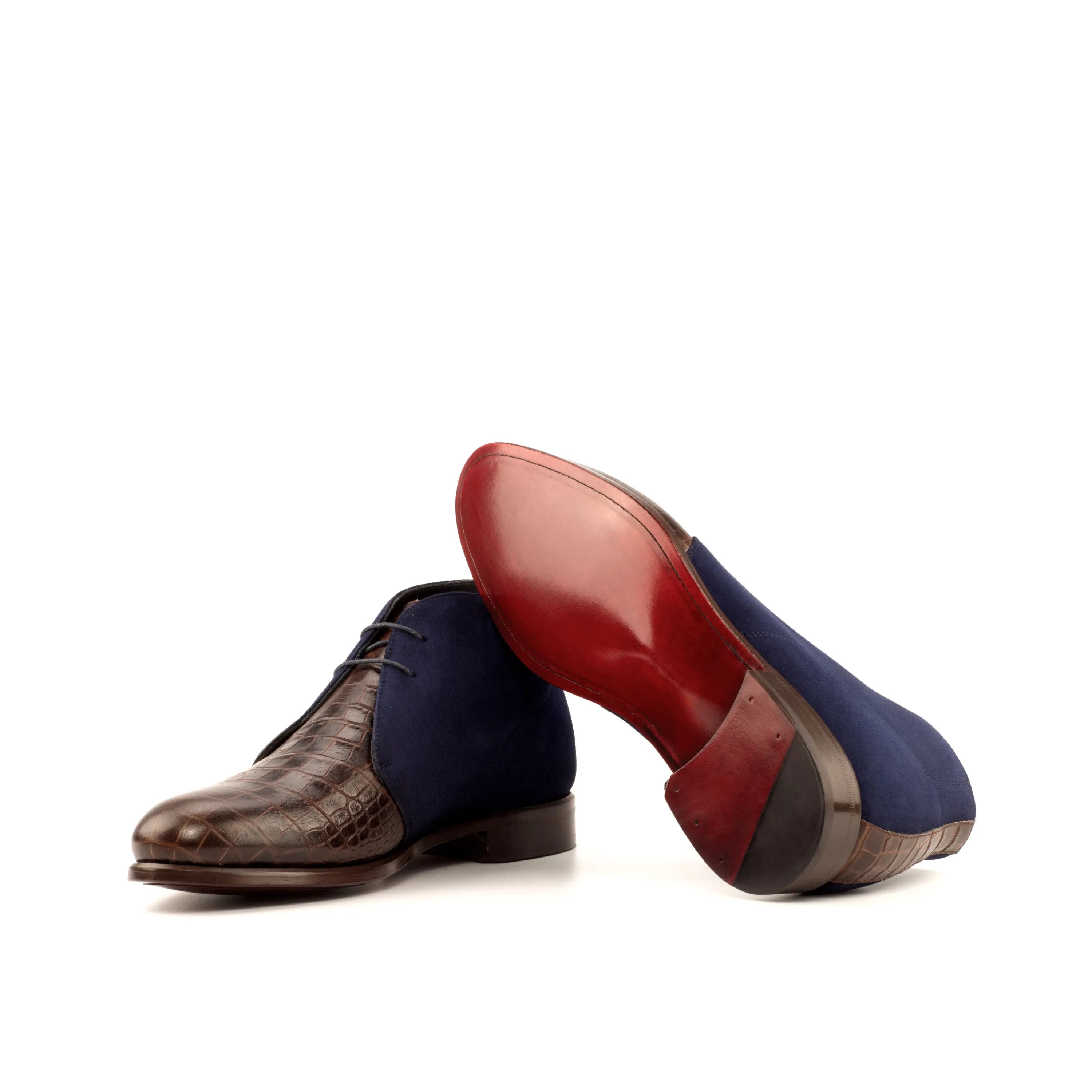 Two-toned leather and suede Geovano Chukka boots displayed elegantly