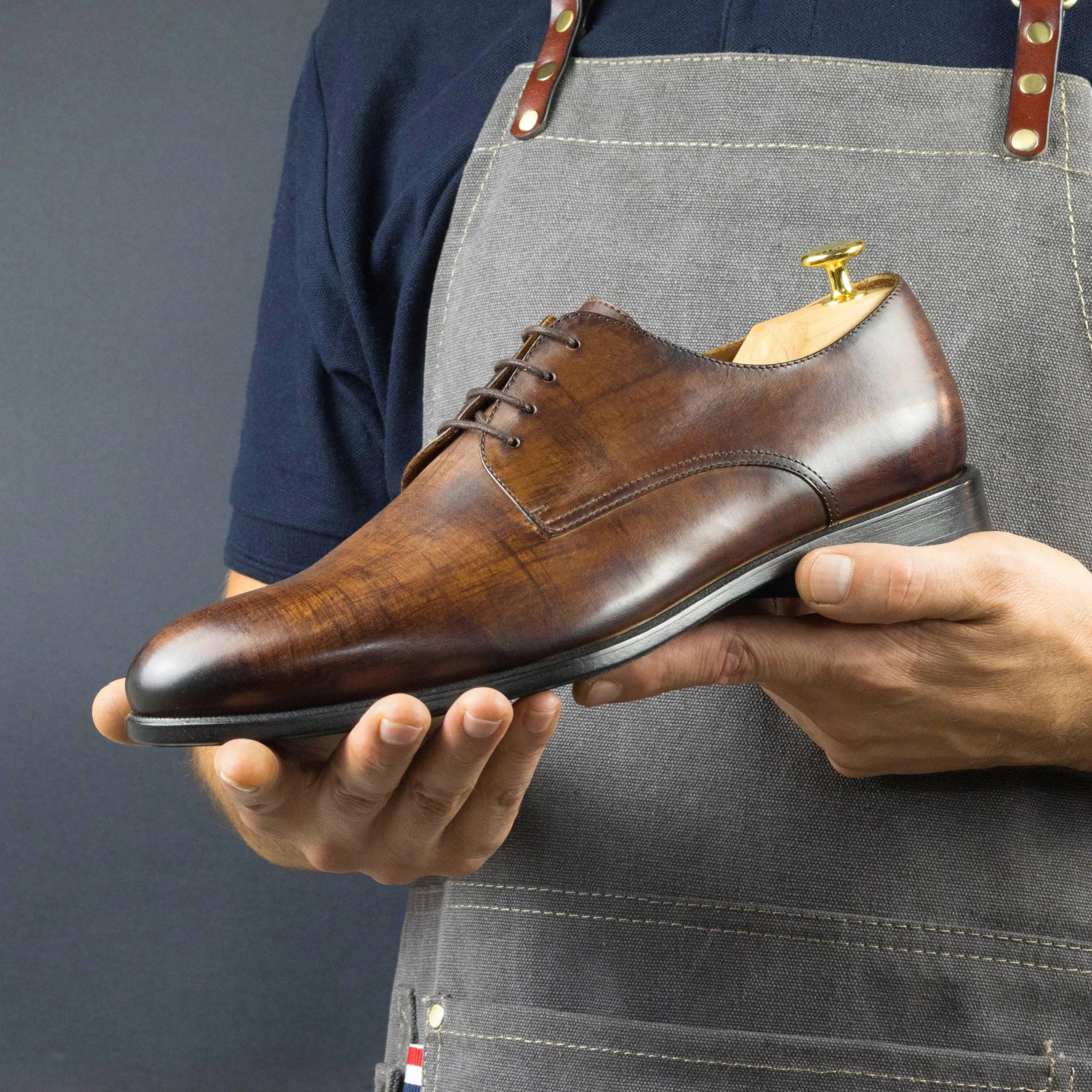 Brown leather Gezzle Derby Patina shoes showcasing elegance and style in footwear
