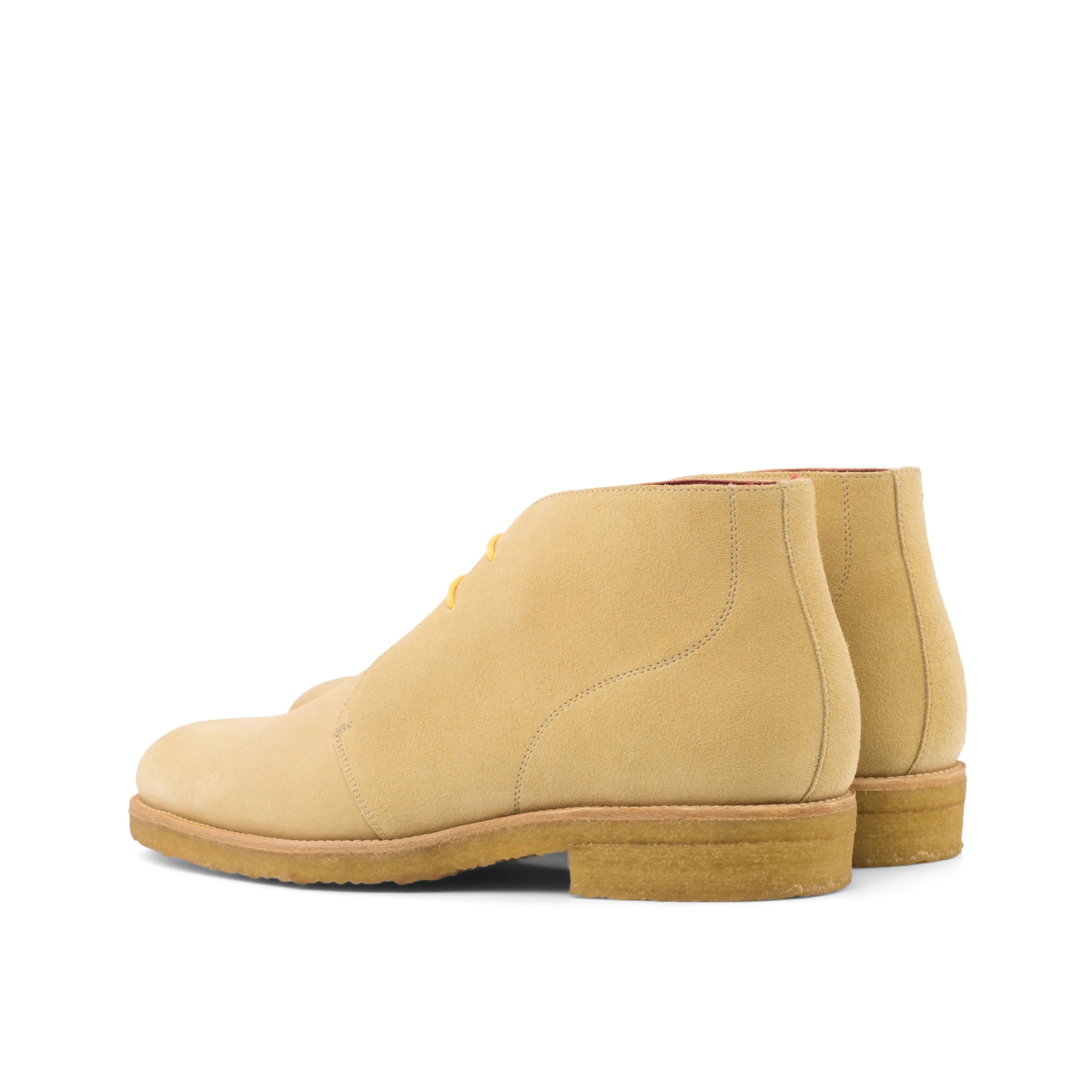 Tan suede Gmar Chukka boots displaying elegance and versatility in footwear