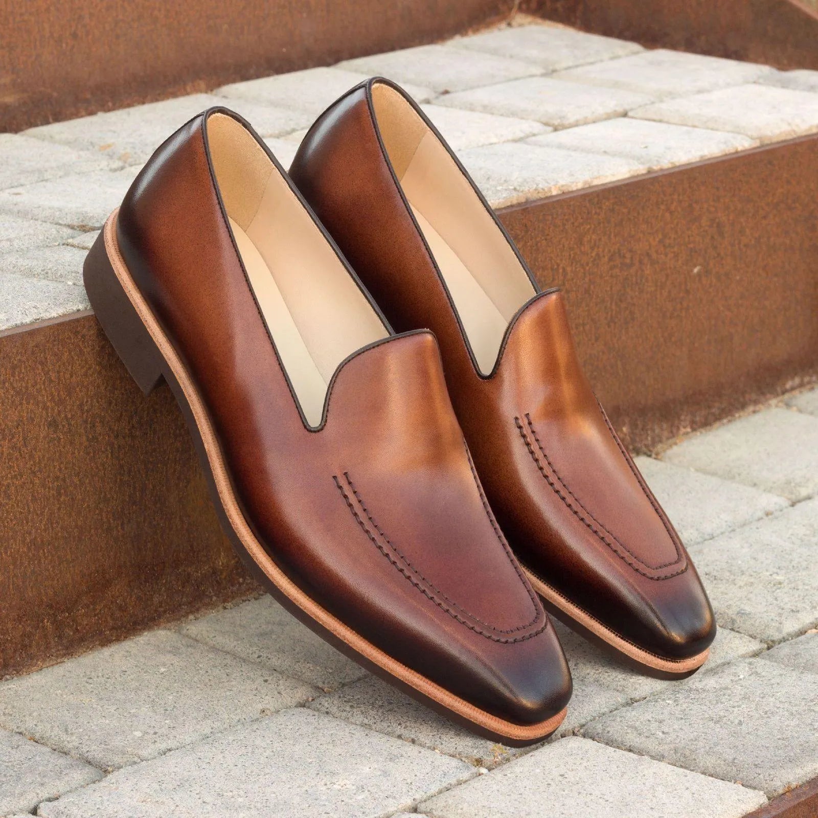 Pair of brown painted calf leather loafers, elegantly designed as Gold Loafers