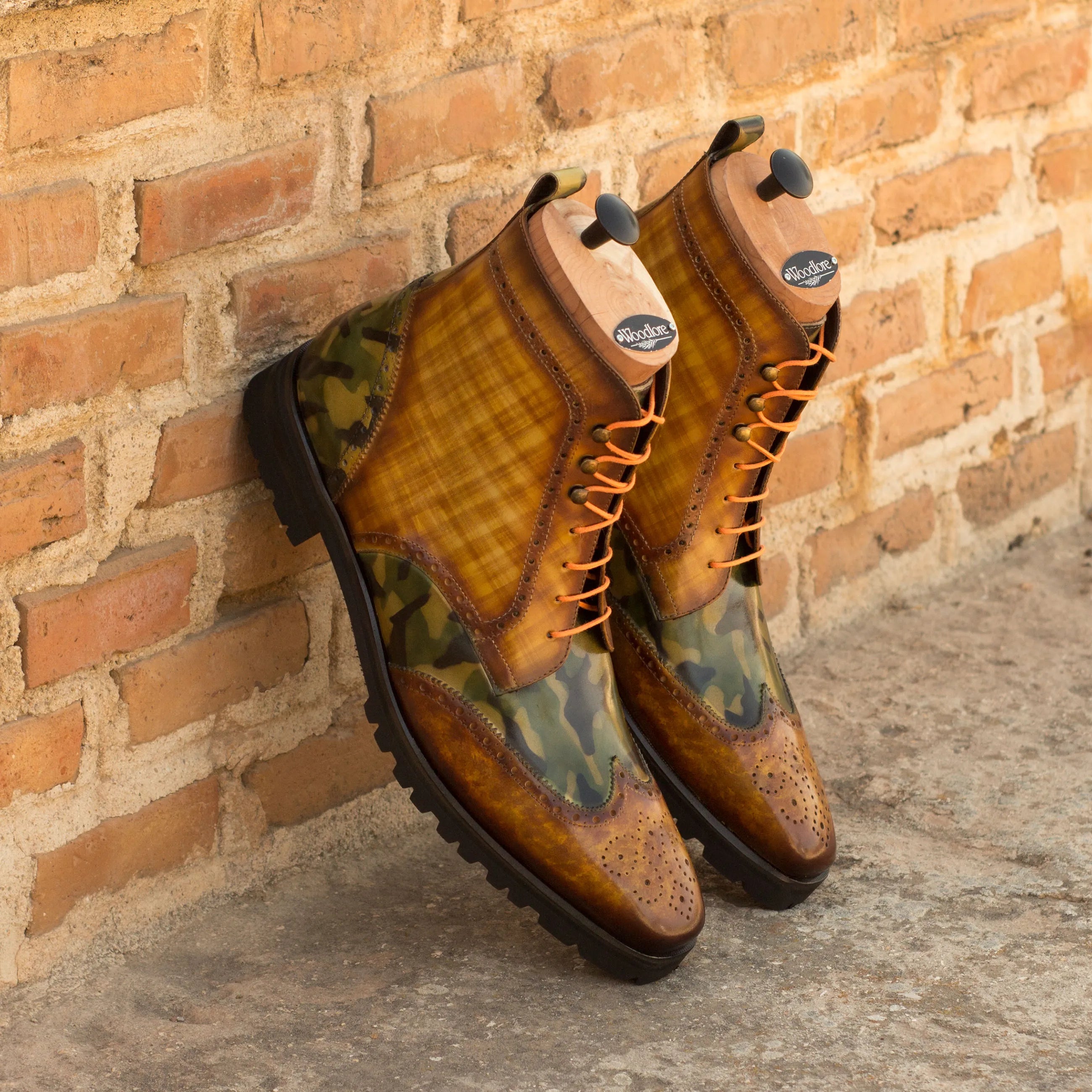 Two-tone leather wingtip boots featuring the Goodlife Military Brogue design