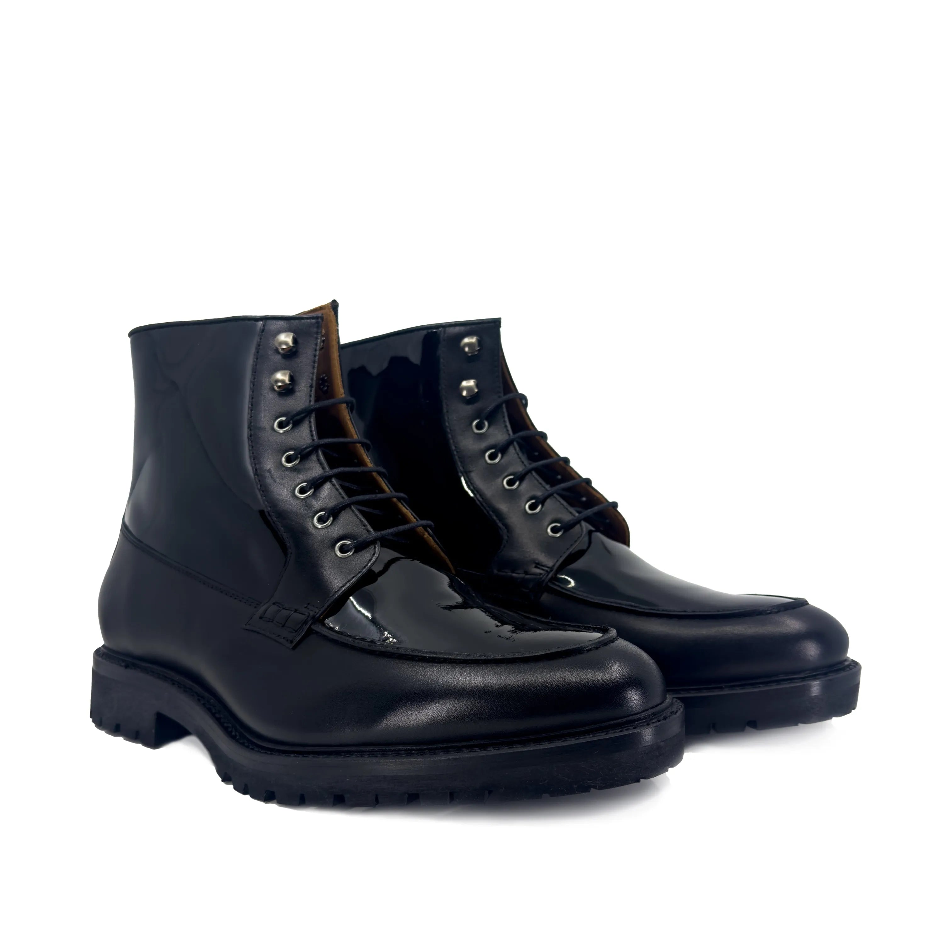 Black leather lace-up shoes showcasing Grandeur Moc Boot style and craftsmanship