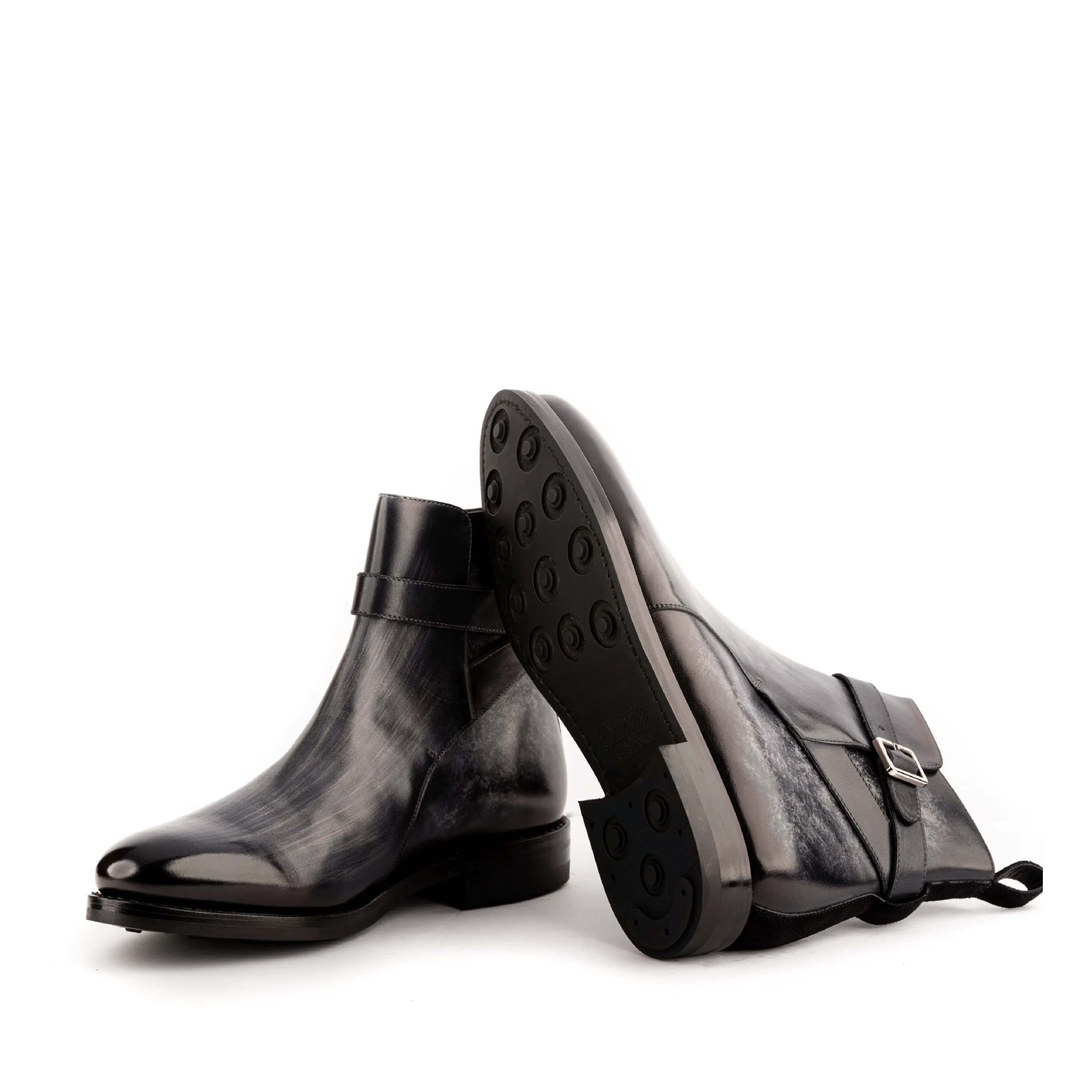 Pair of black leather Greco Jodhpur Patina boots showcasing elegant craftsmanship