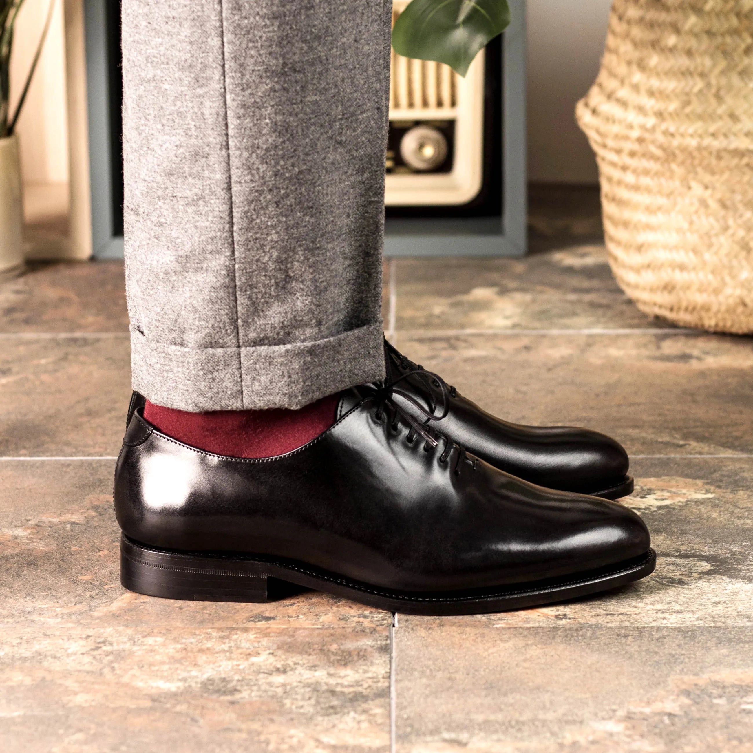 Black leather Hans Wholecut shoes showcasing elegance and timeless style