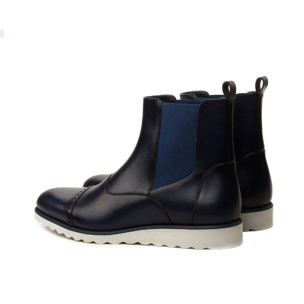 Hardwin Chelsea Boots in navy blue leather with stylish white soles