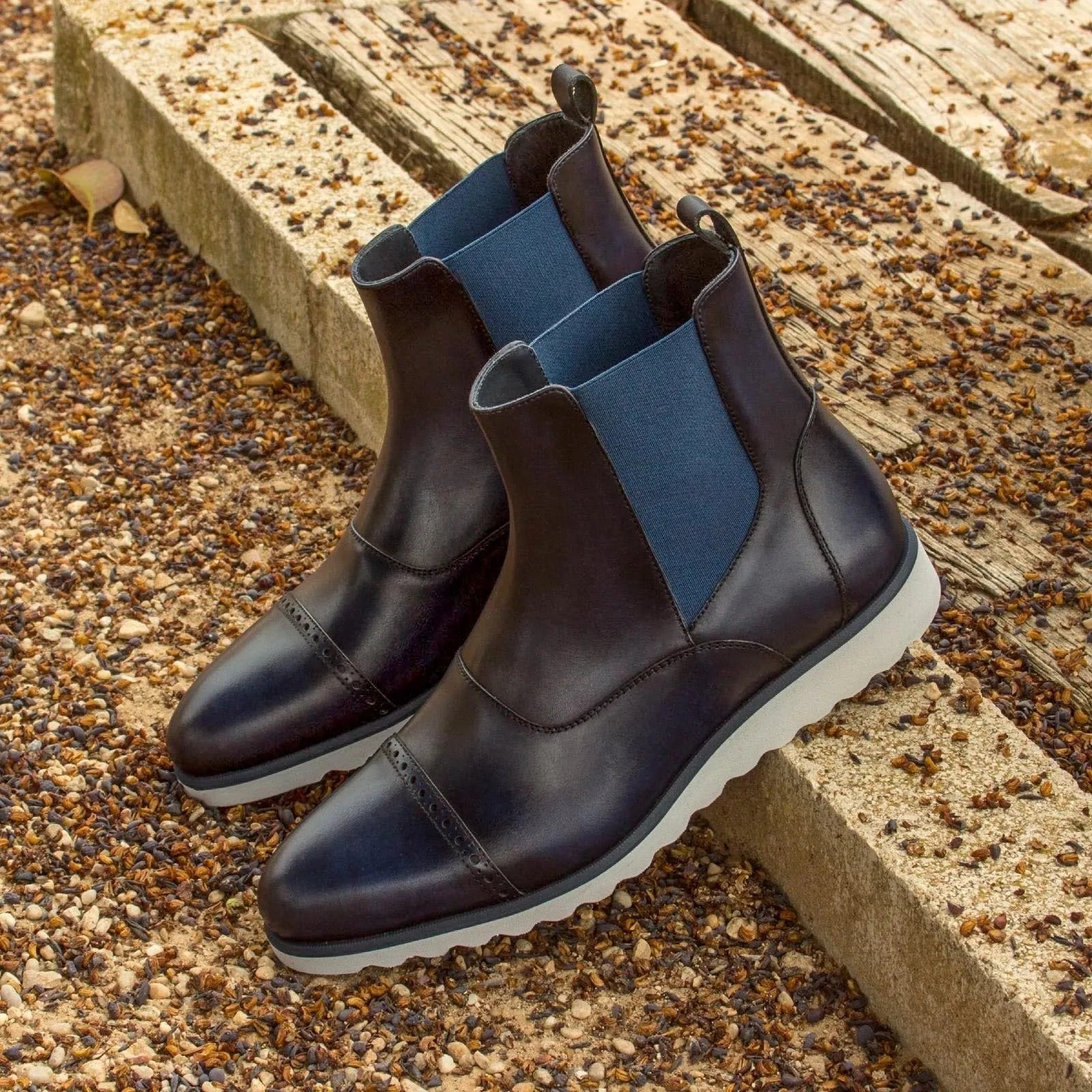 Pair of navy blue leather Hardwin Chelsea Boots for stylish footwear elegance