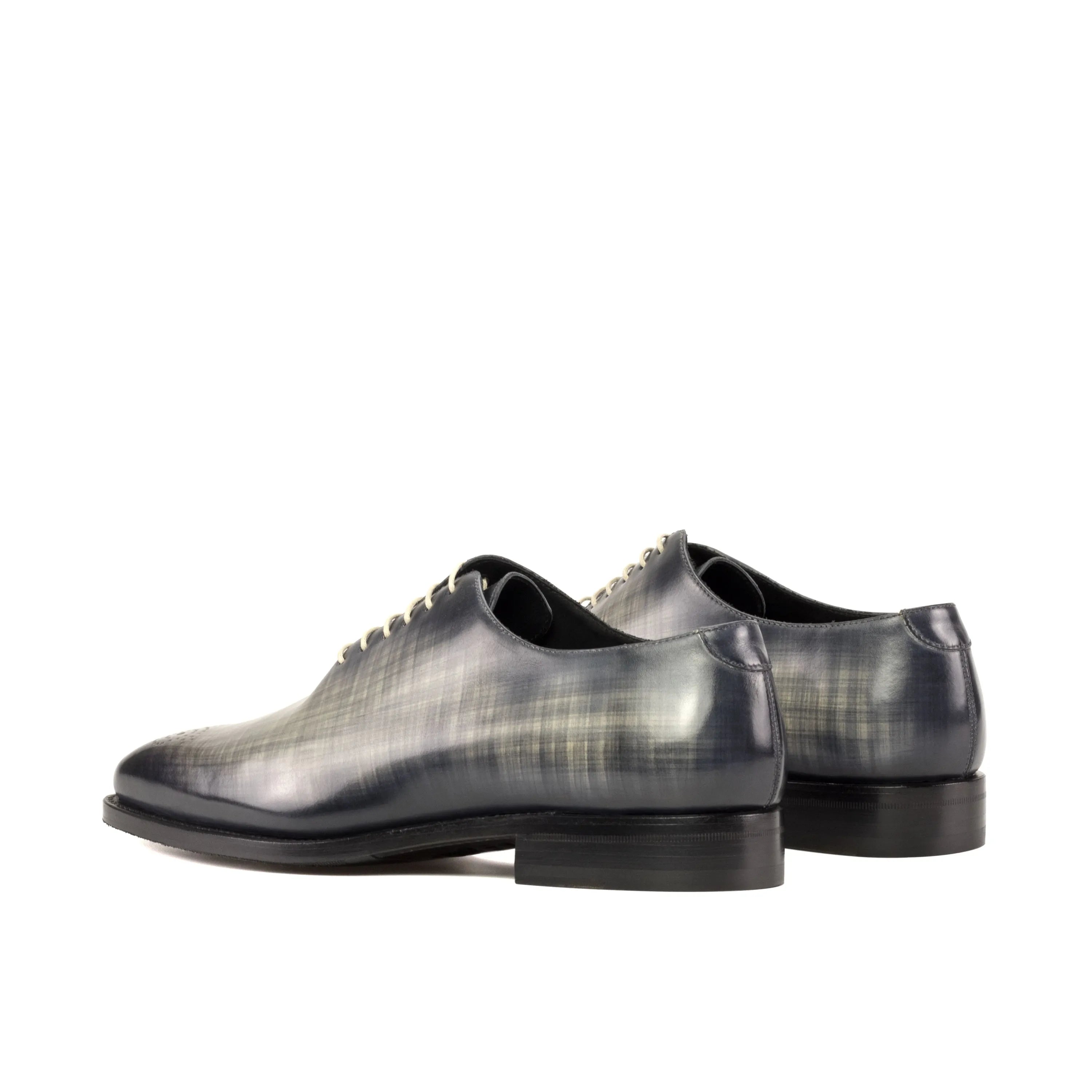 Gray leather Havier whole cut patina shoes showcasing elegant design and craftsmanship