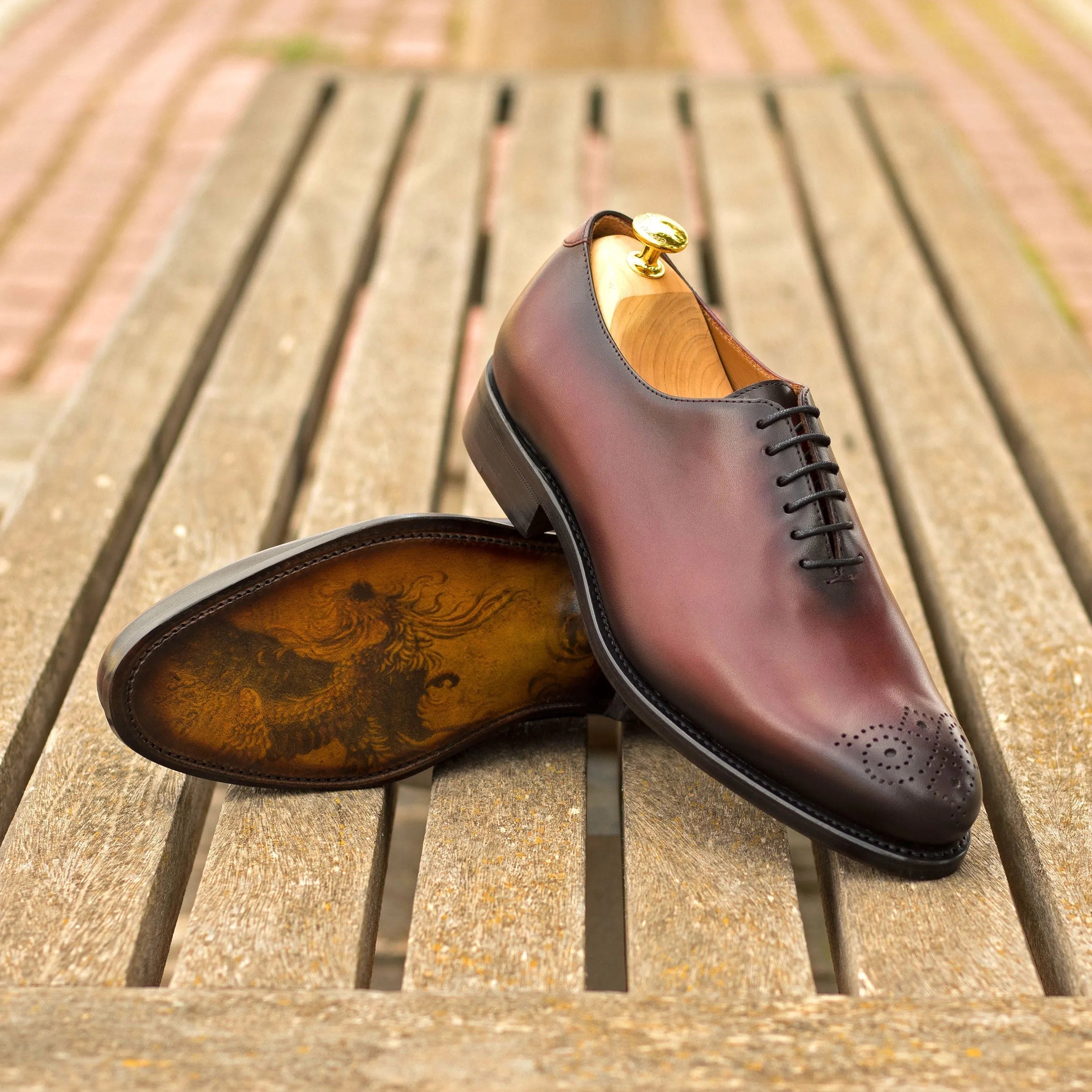 Burgundy leather Himari wholecut shoes displayed elegantly for stylish formal wear
