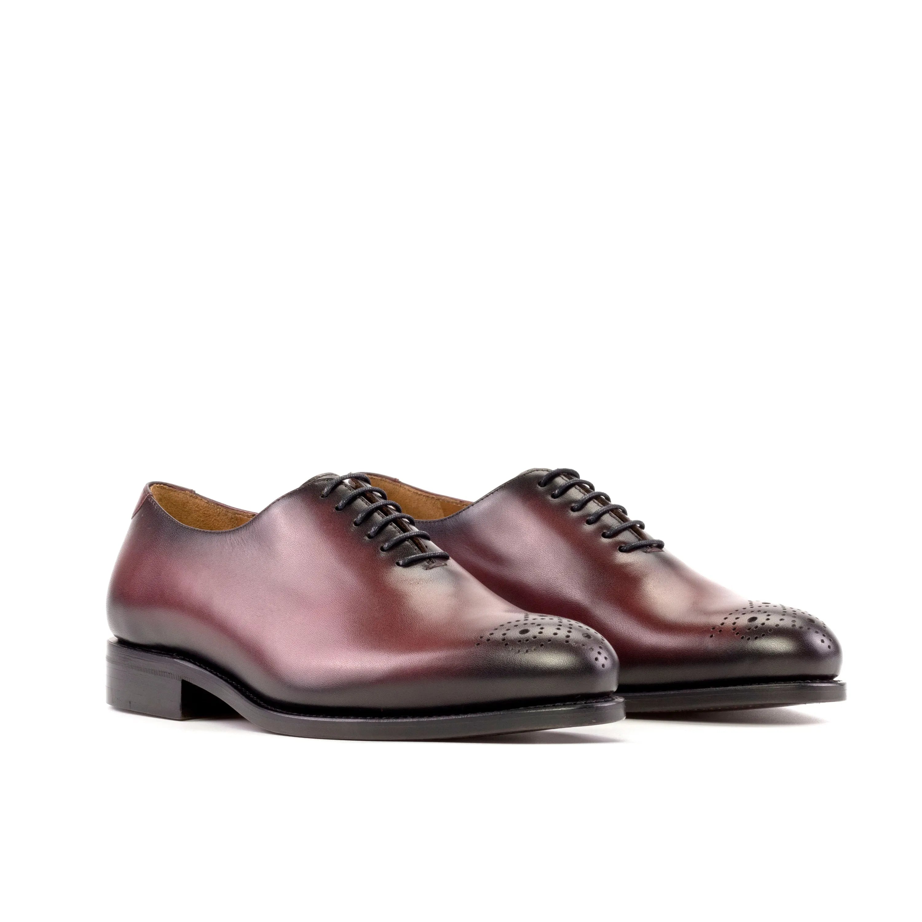 Pair of burgundy leather Himari wholecut shoes showcasing elegant craftsmanship
