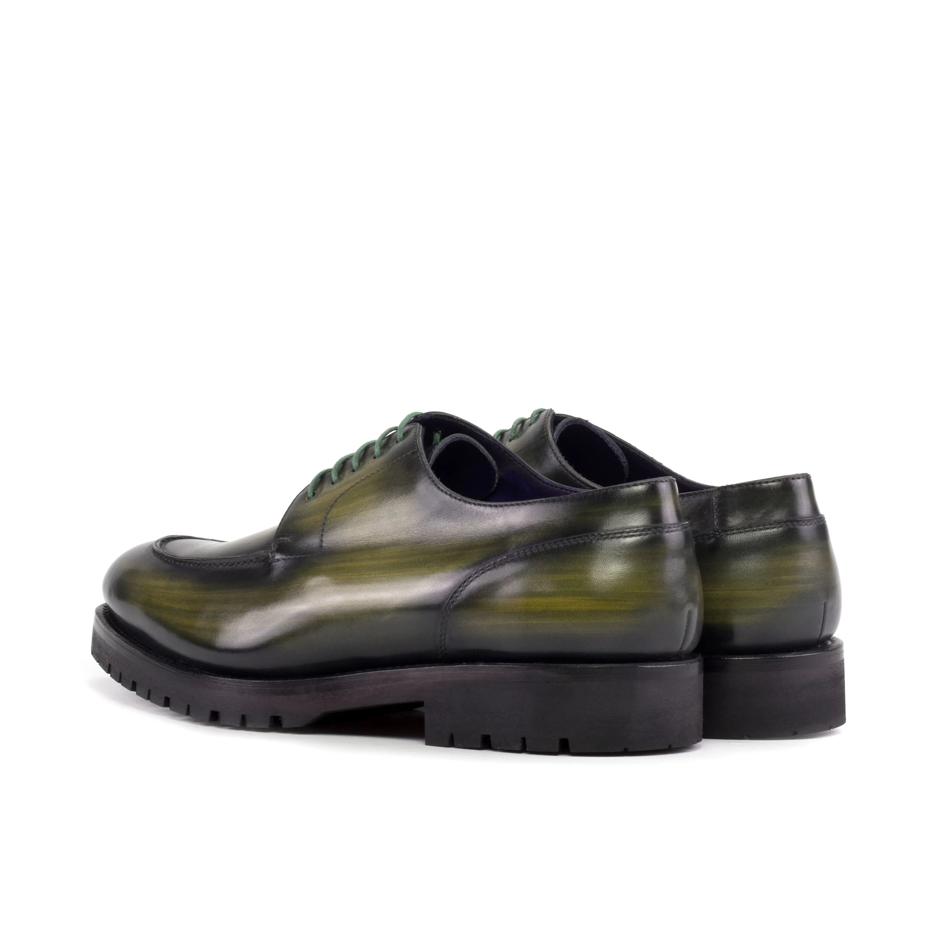 Green leather Jarama Derby Split Toe Patina shoes showcasing elegant craftsmanship