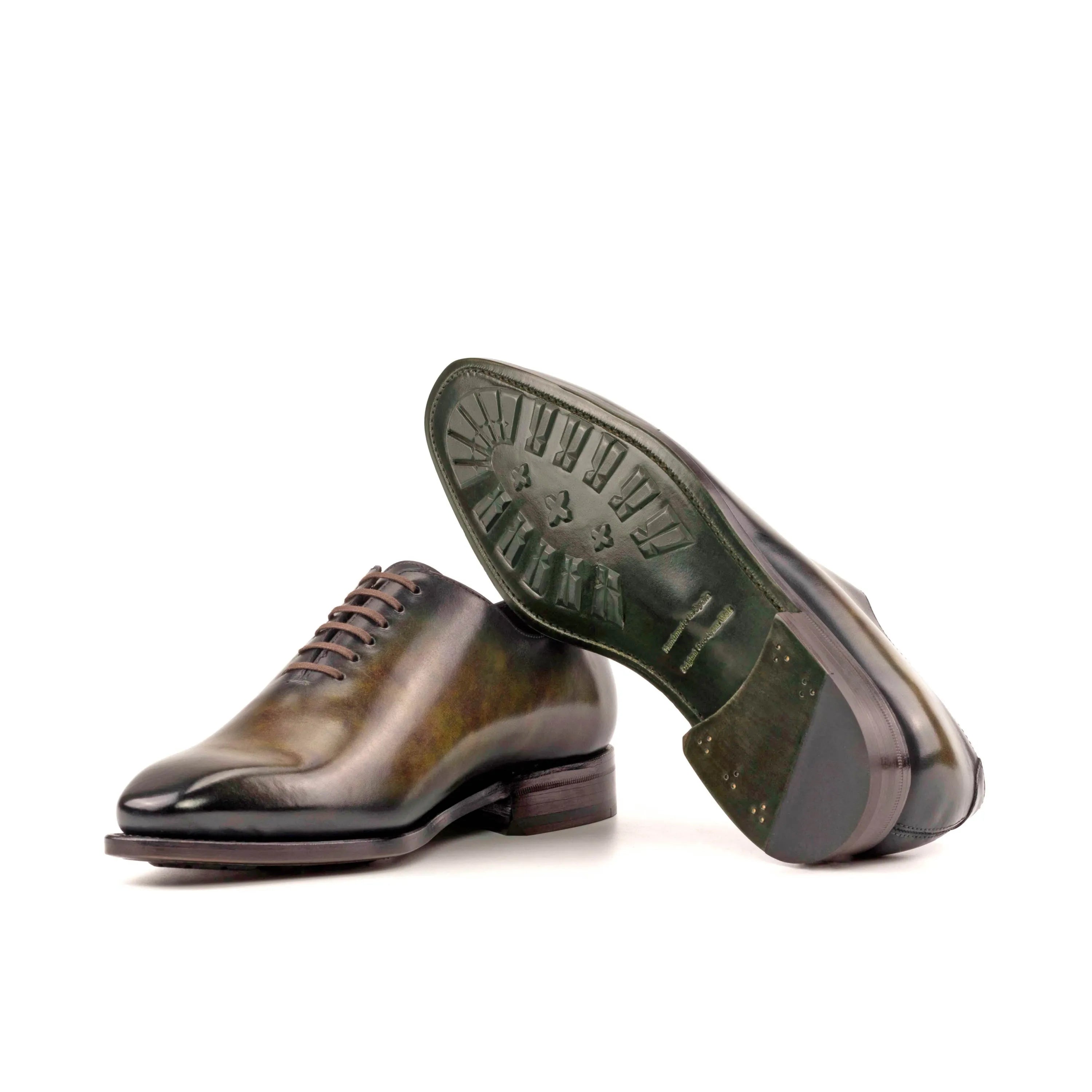 Two brown leather Javn Patina Wholecut shoes elegantly displayed for discerning buyers