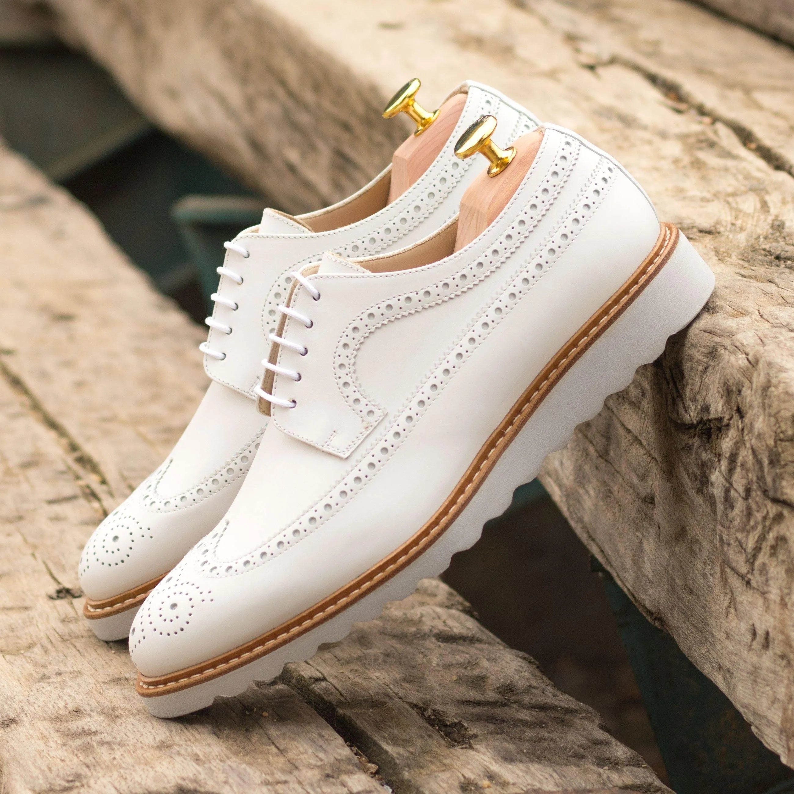 White leather Jay Longwing Blucher shoes featuring a classic wingtip design