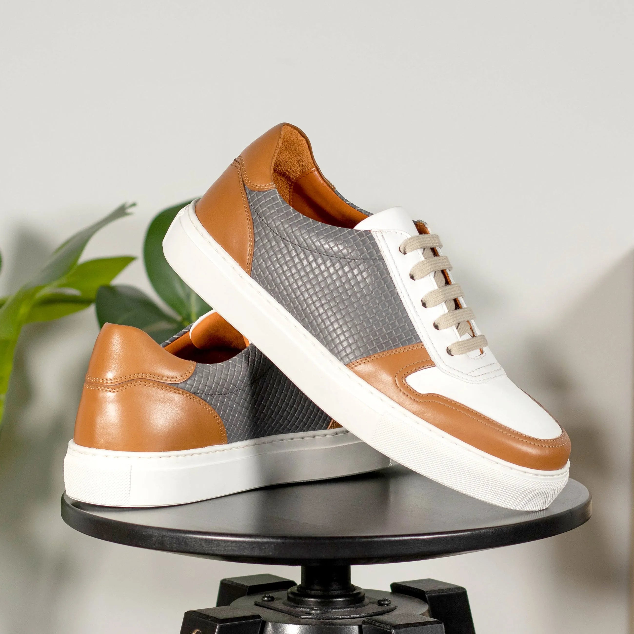 Brown, gray, and white leather JiJi unisex trainer sneaker with cupsole design