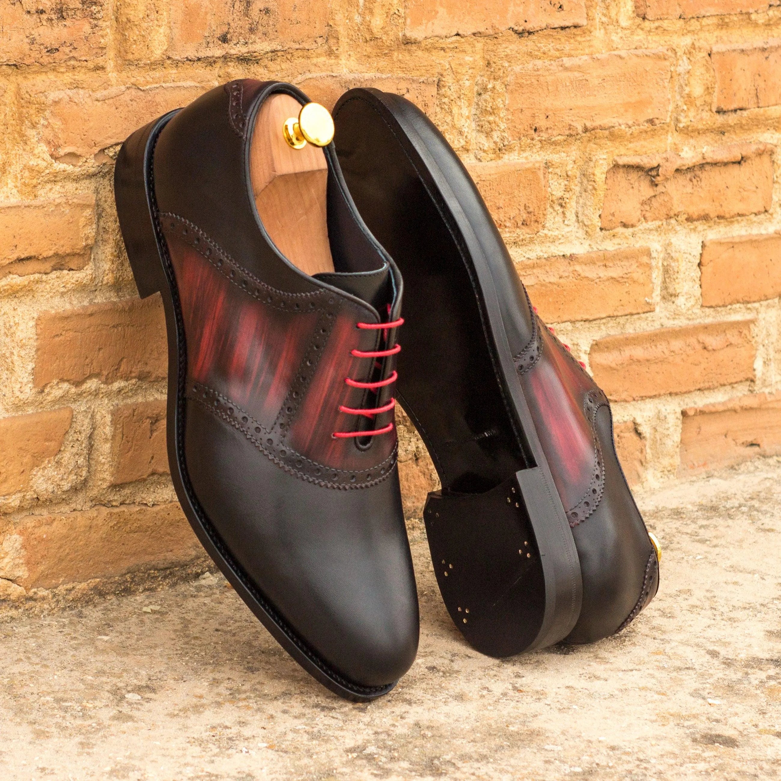 Black and red leather Jiovani Saddle Patina shoes showcasing elegant design and craftsmanship