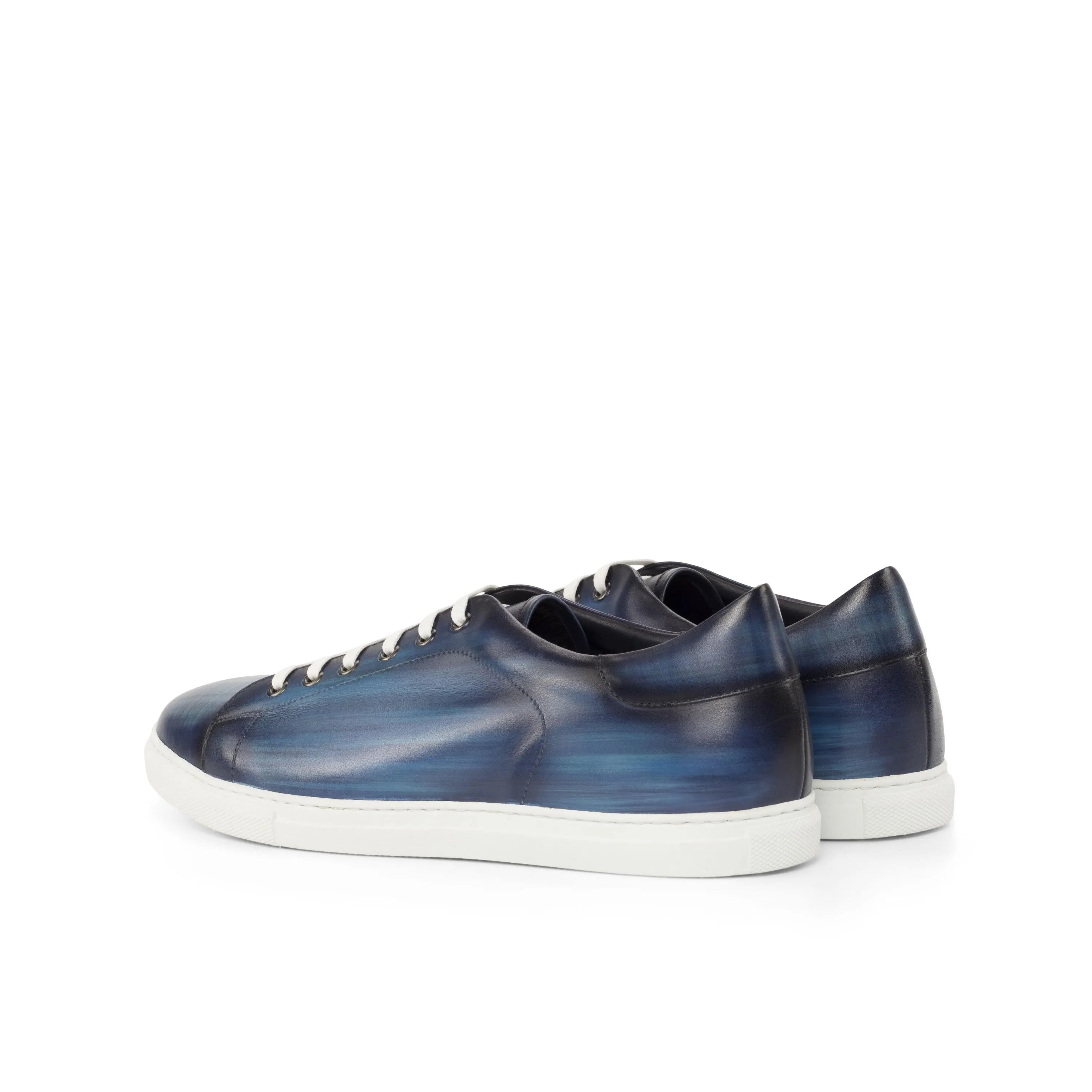 Blue leather sneakers featuring the Jorar Trainer Patina design with a cupsole trainer style