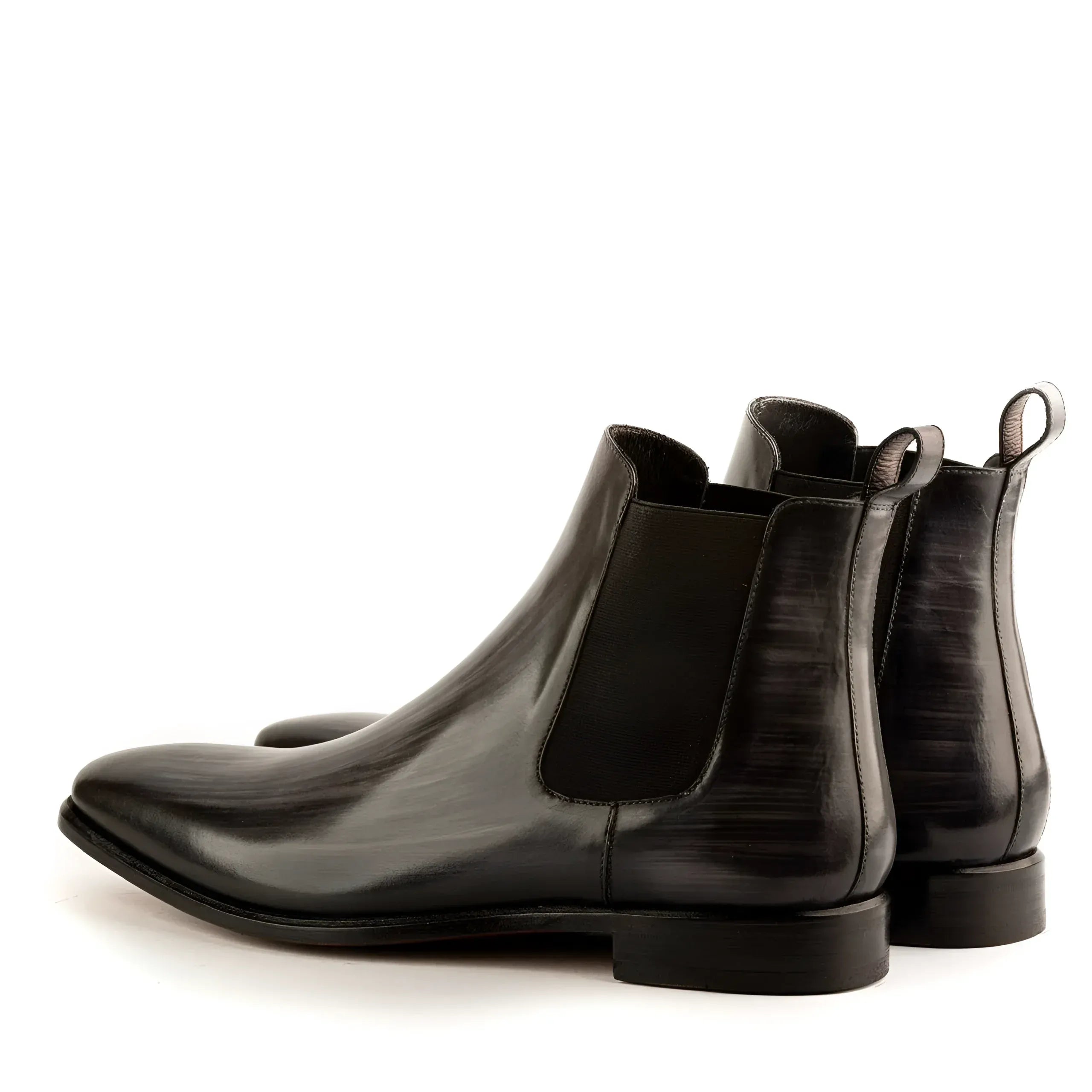 Pair of black leather JT Chelsea Patina Boots showcasing elegant style and durability