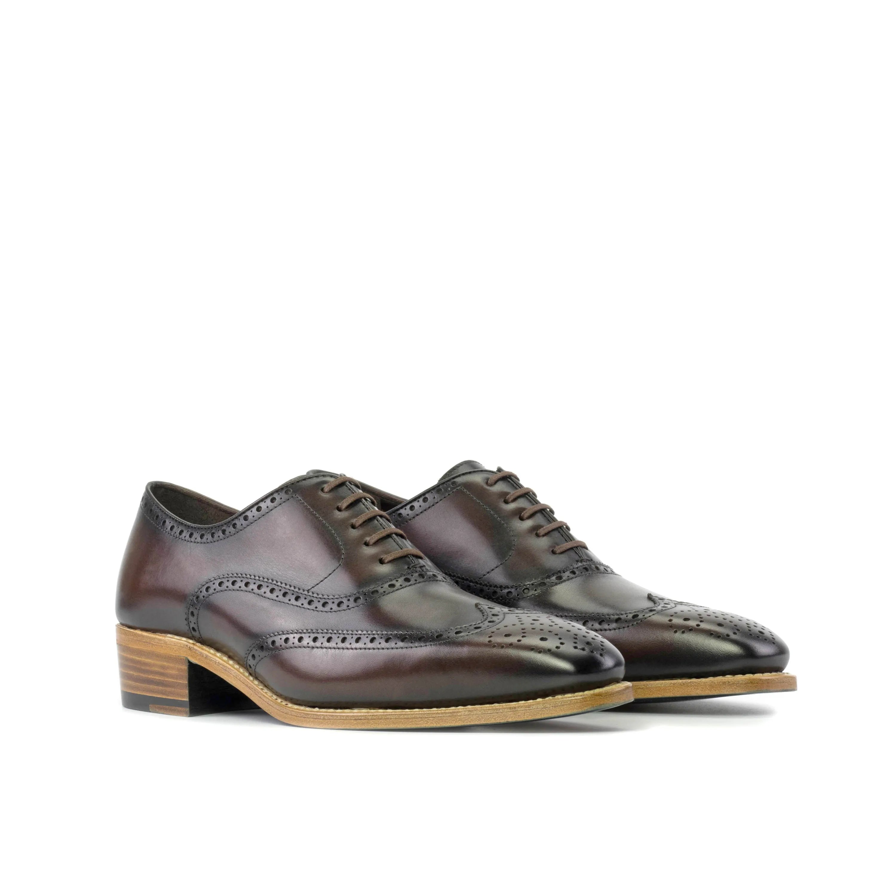 Pair of brown leather brogue dress shoes named Juluis Full Brogue Shoes for the fast lane