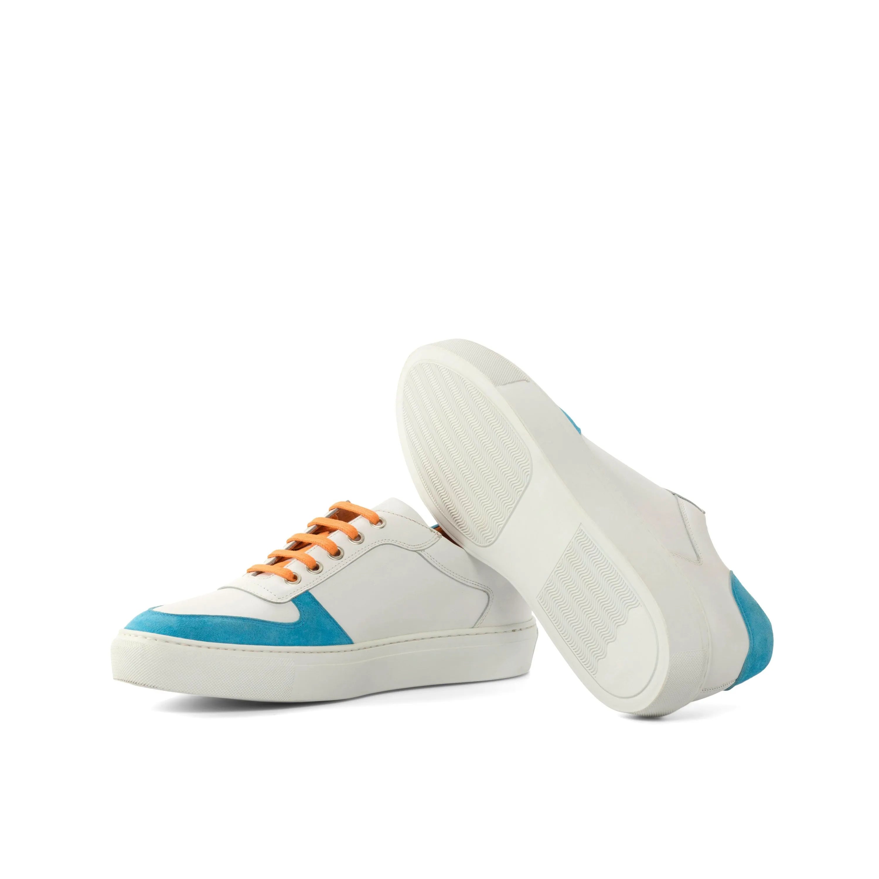 Junos Low Top Sneaker in white leather with blue accents and orange laces, trendy trainer sneakers