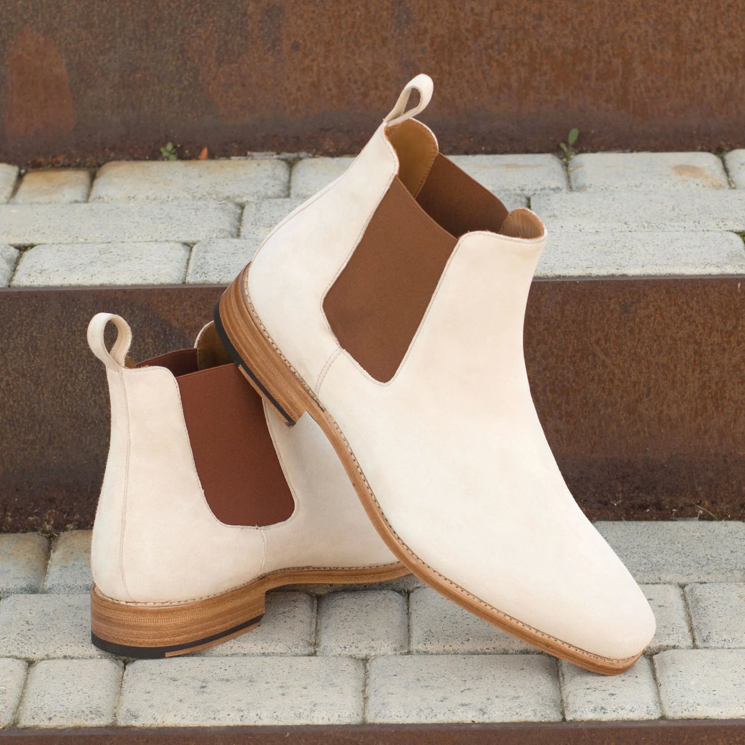 Pair of white suede Kangee Chelsea Boots showcasing elegant footwear style