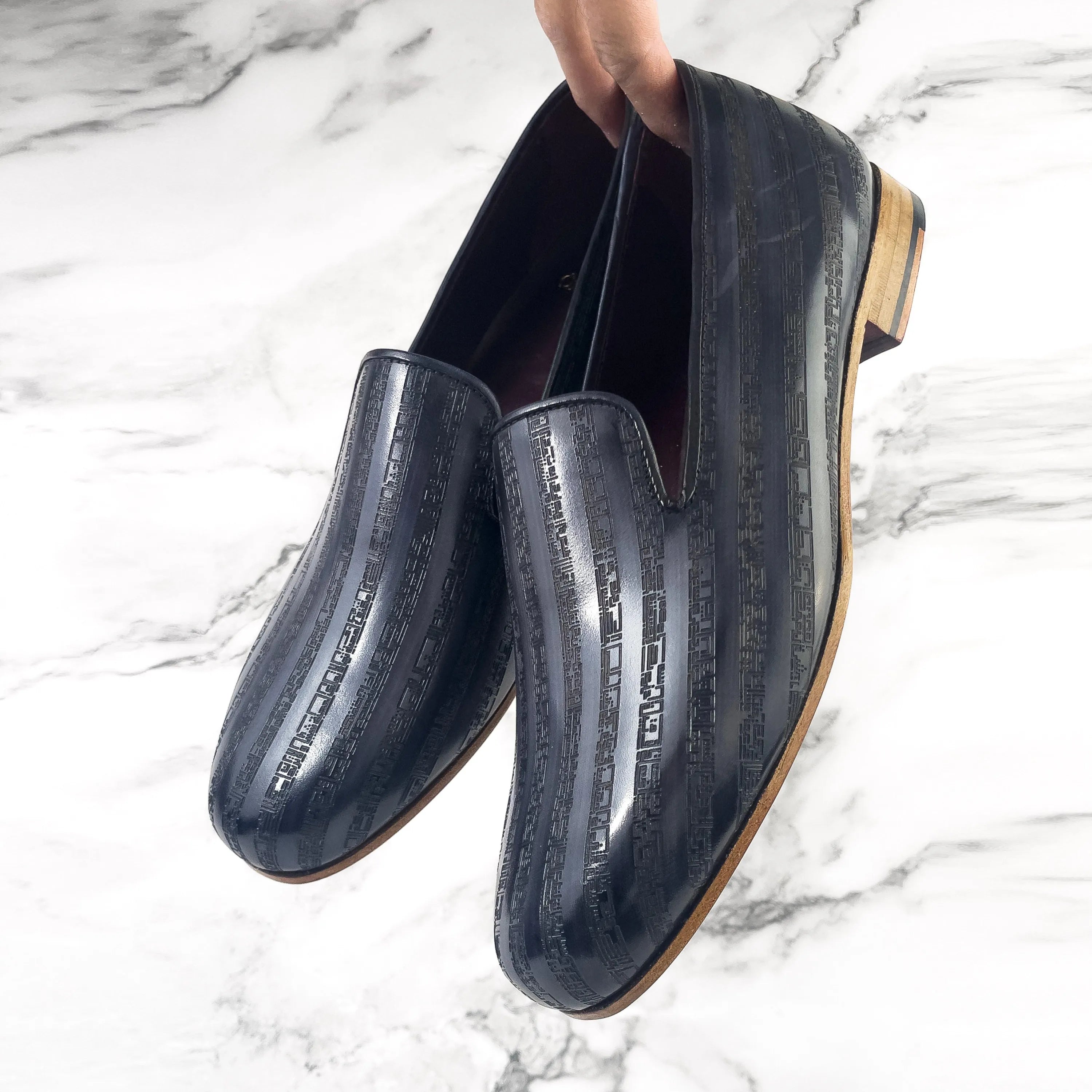 Striped black leather loafers from the Khalil Patina Wellington collection