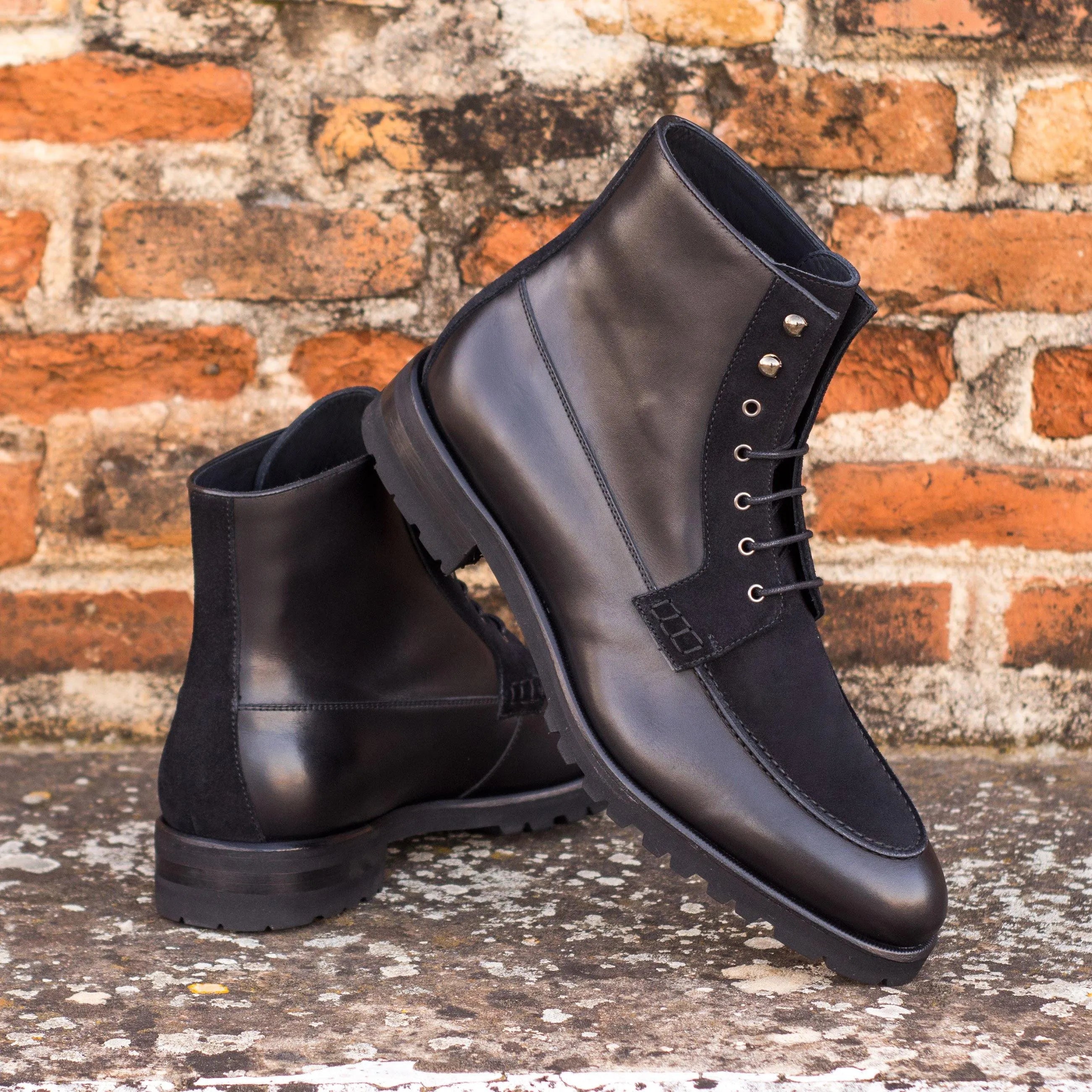 Pair of black leather and suede Kindrick Moc Boots for stylish comfort and durability