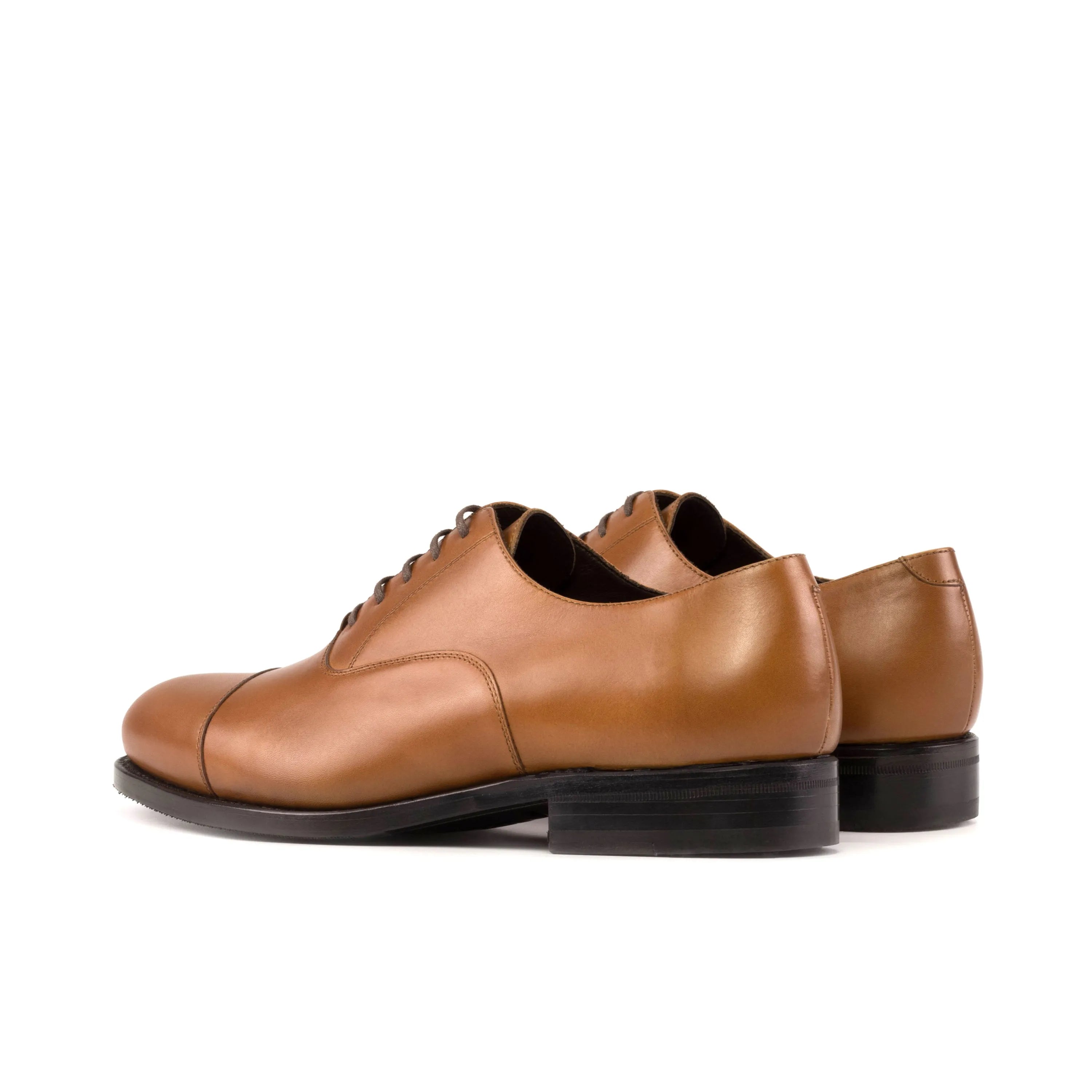 Pair of brown leather Klavio Oxford shoes displayed for stylish formal wear