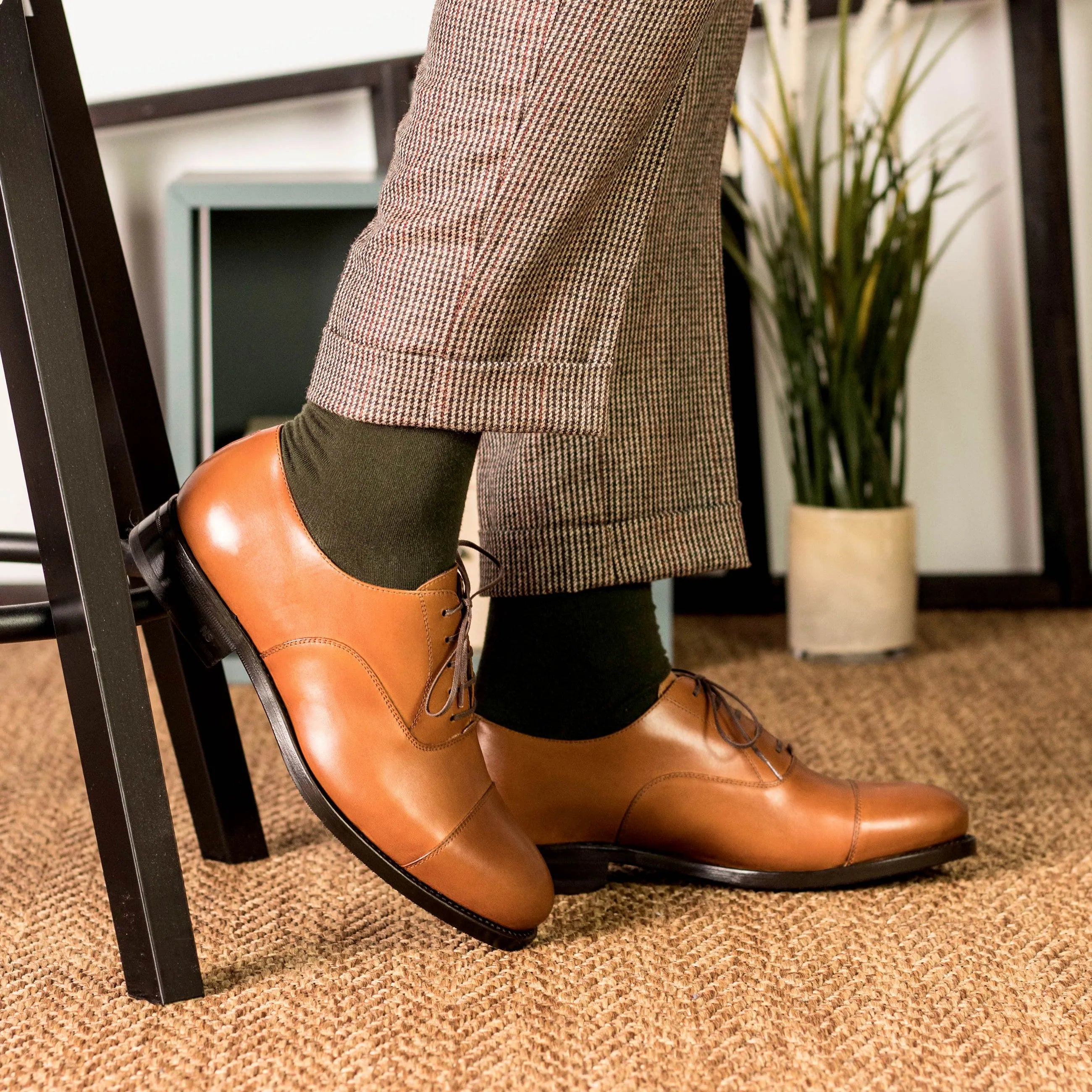 Tan leather Klavio Oxford shoes showcased for fast lane style and elegance