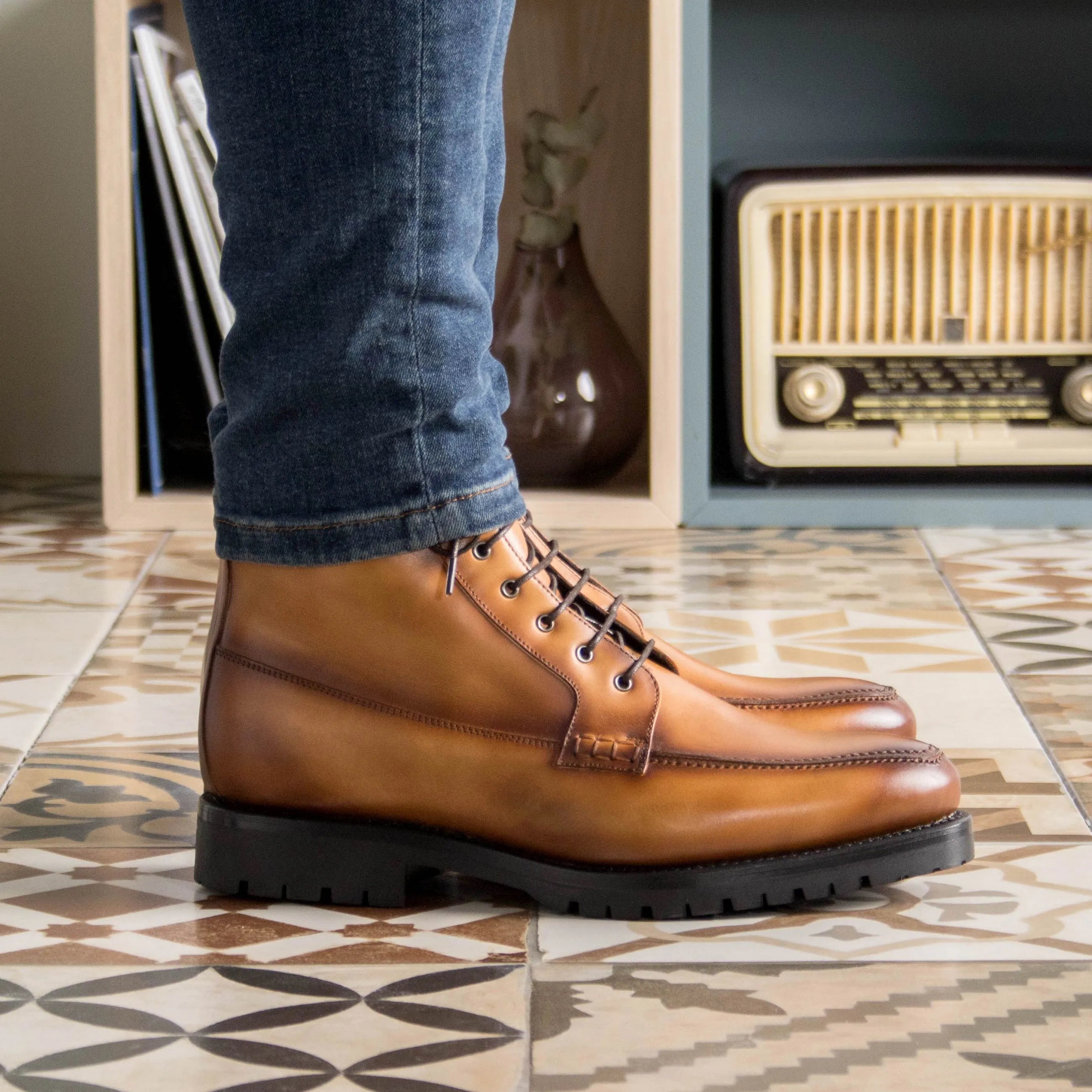 Brown leather lace-up boots, featuring Landon Moc Boots design for stylish comfort