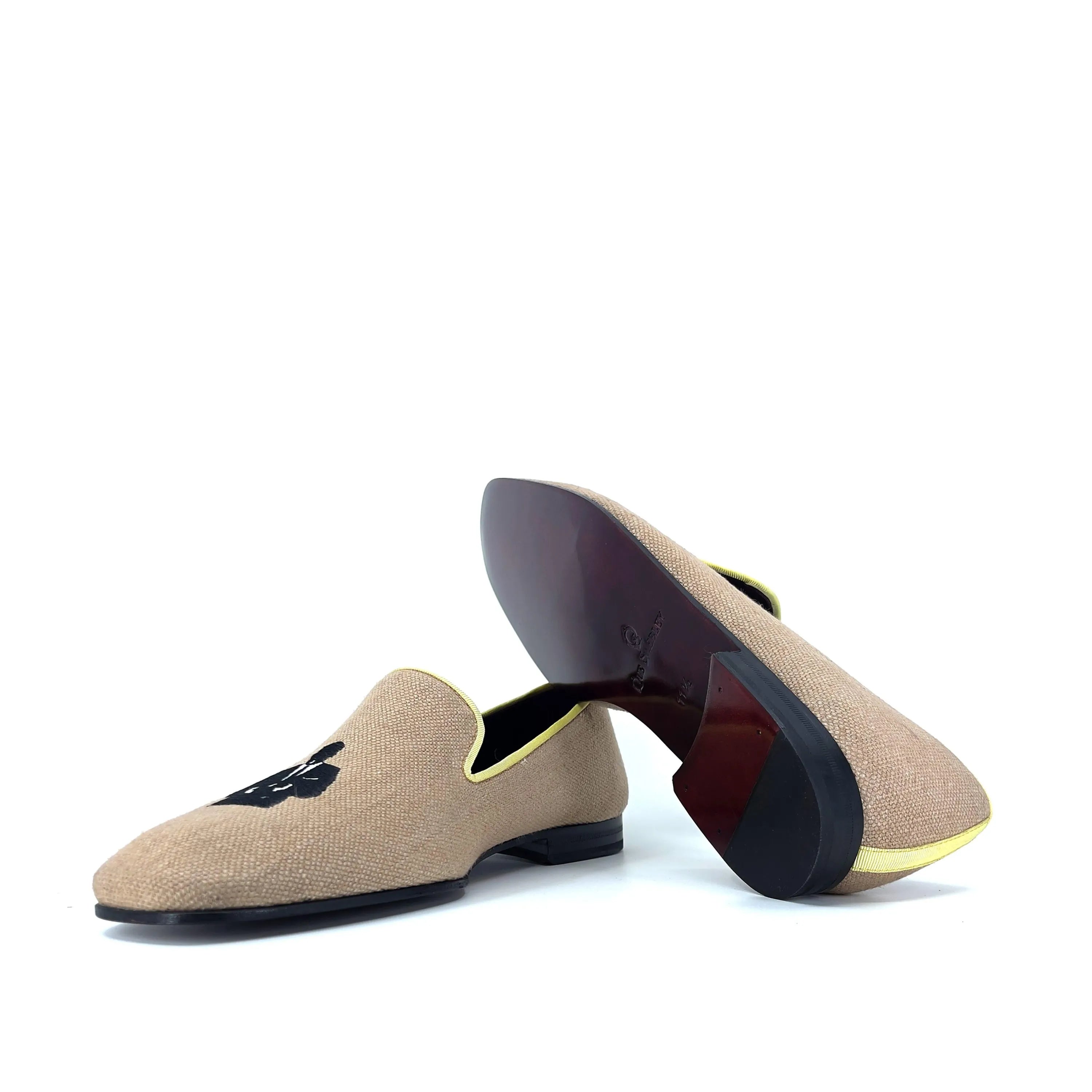 Tan loafers with black design, featuring the stylish Lane Drake Slipon collection