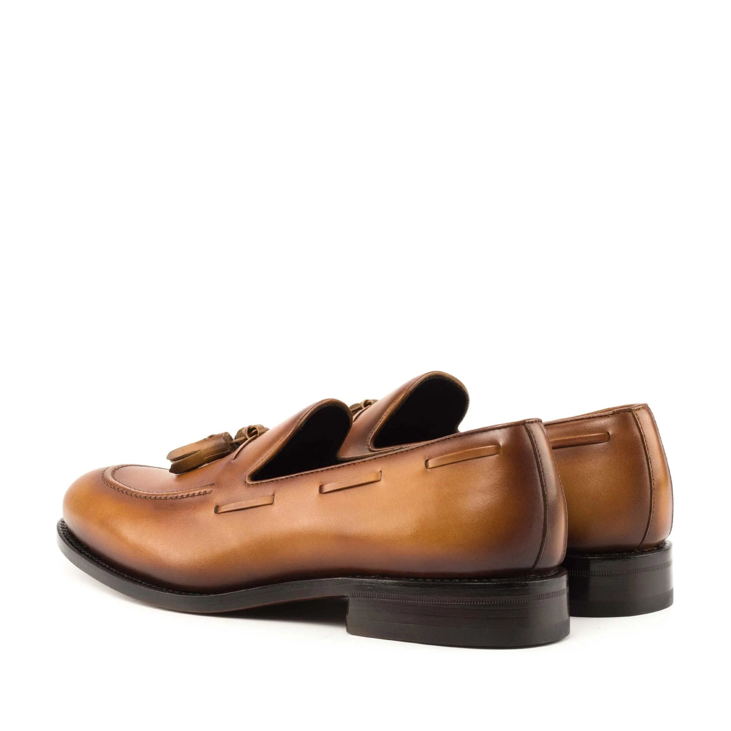 Brown leather tassel loafers named Leon Loafers for a sophisticated business look