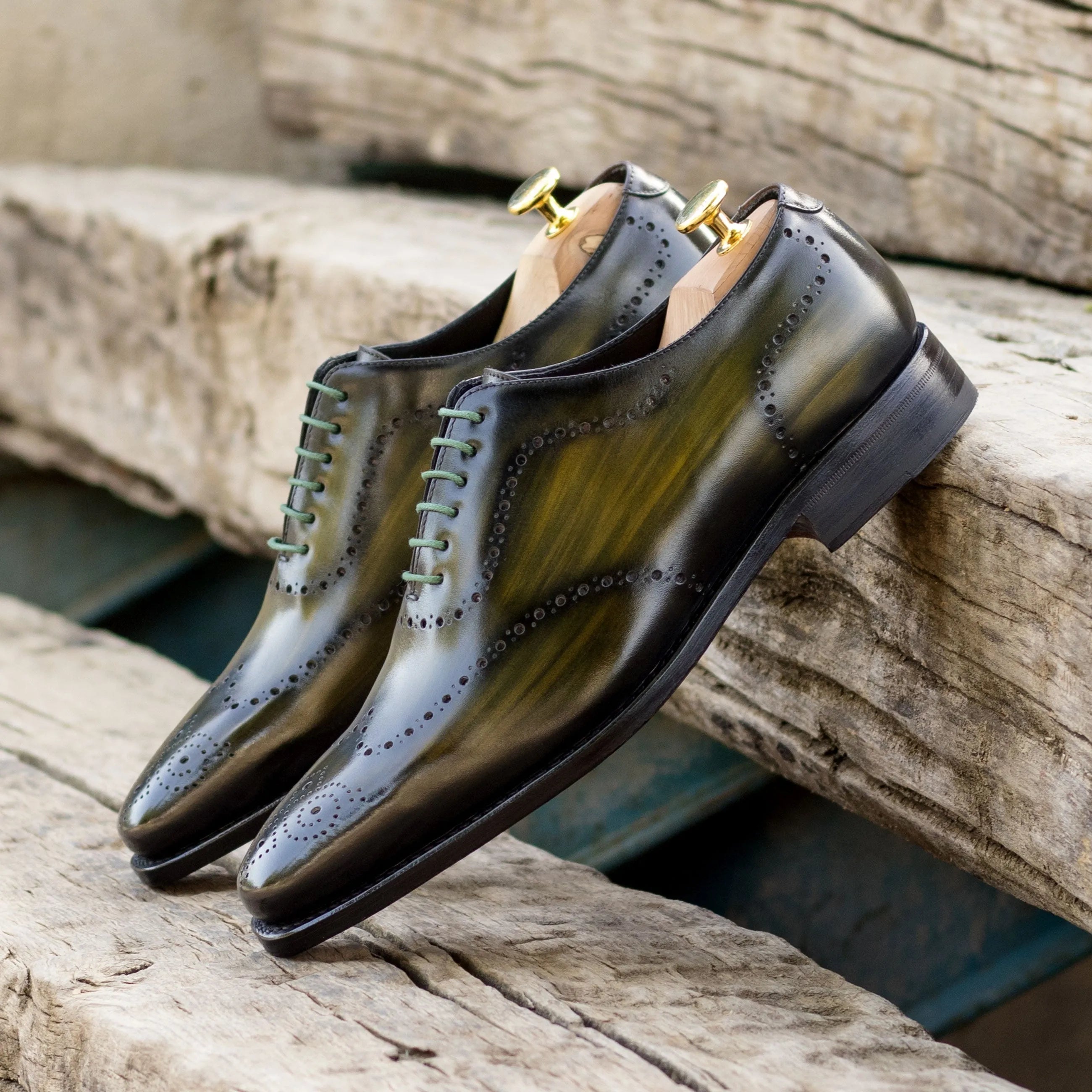 Shiny green-tinted leather dress shoes from the Lequa Wholecut Patina collection