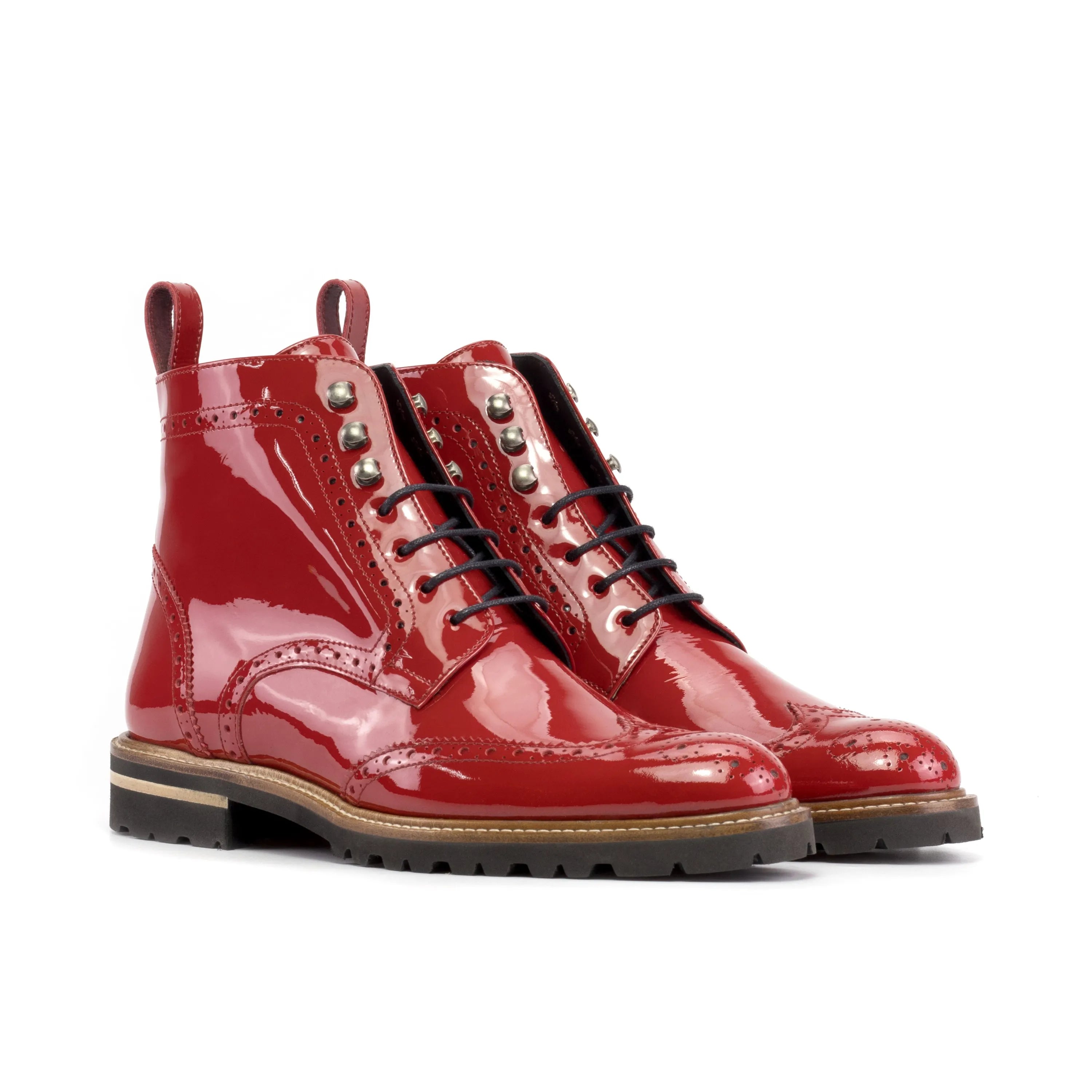 Pair of red patent leather ankle boots in Lila Unisex Military Brogue design