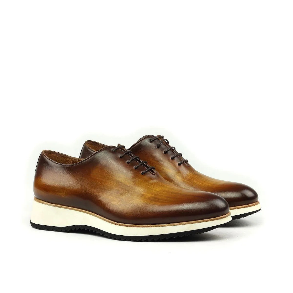 Brown leather Lloyd Wholecut Patina shoes II showcasing elegant craftsmanship