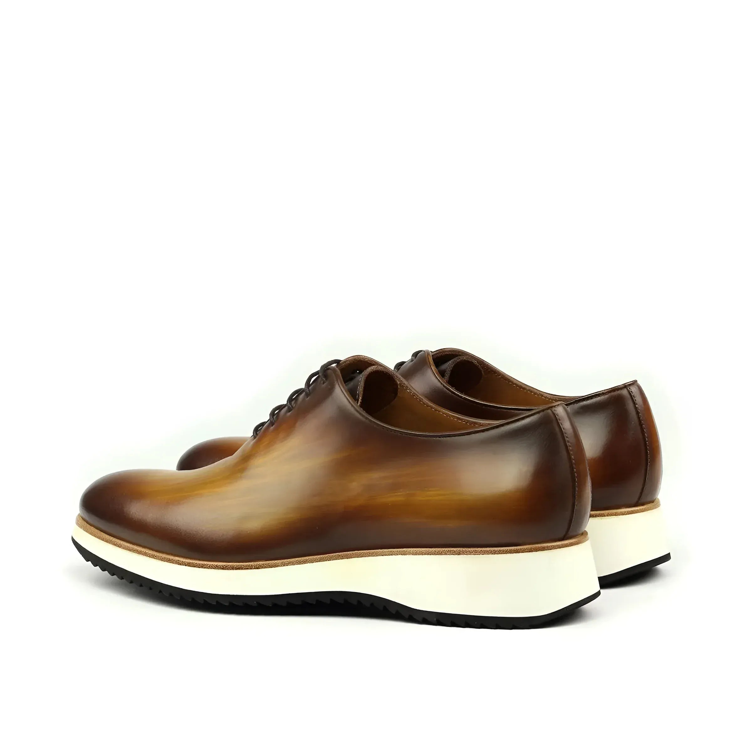 Brown leather Lloyd Wholecut Patina shoes featuring stylish white soles