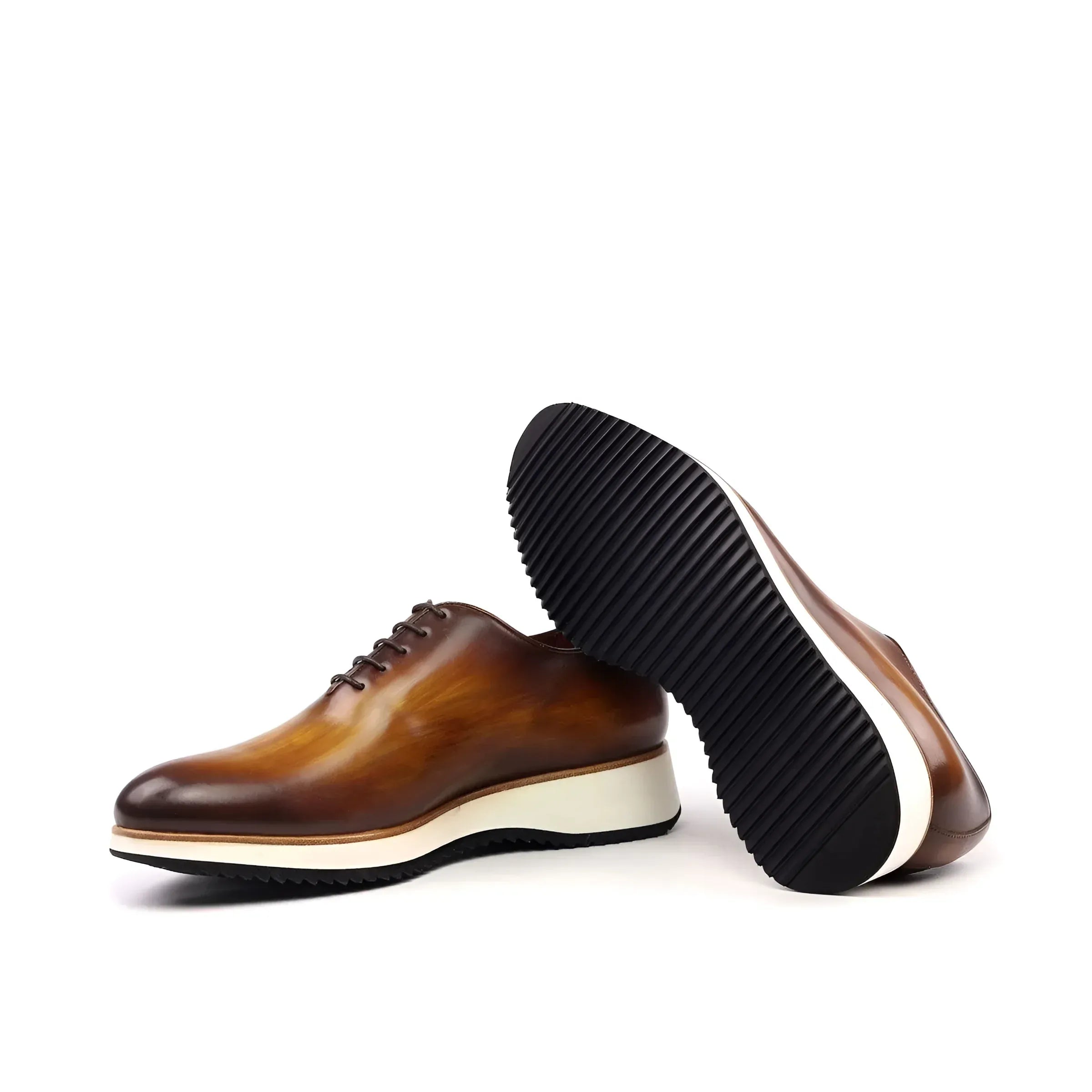 Brown leather Lloyd Wholecut Patina shoes with thick white soles for stylish elegance