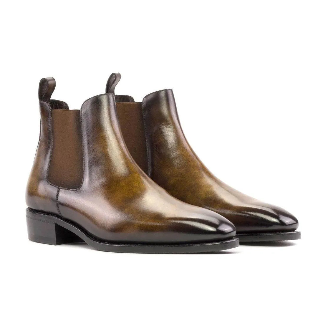 Pair of brown leather Lorenzo Patina Chelsea Boots showcasing elegant design and quality