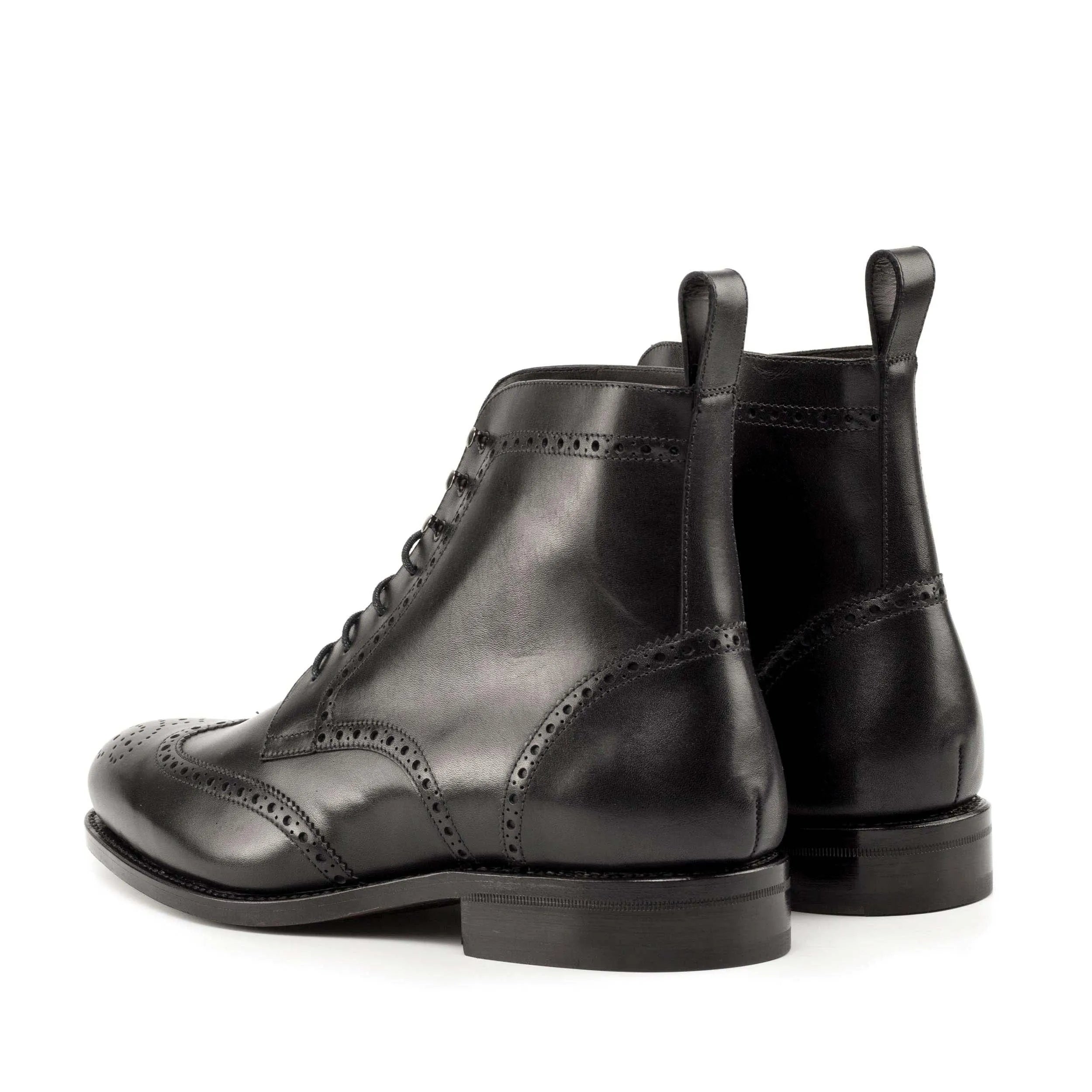 Black leather Luis Military Brogue Boots showcasing elegant wingtip design