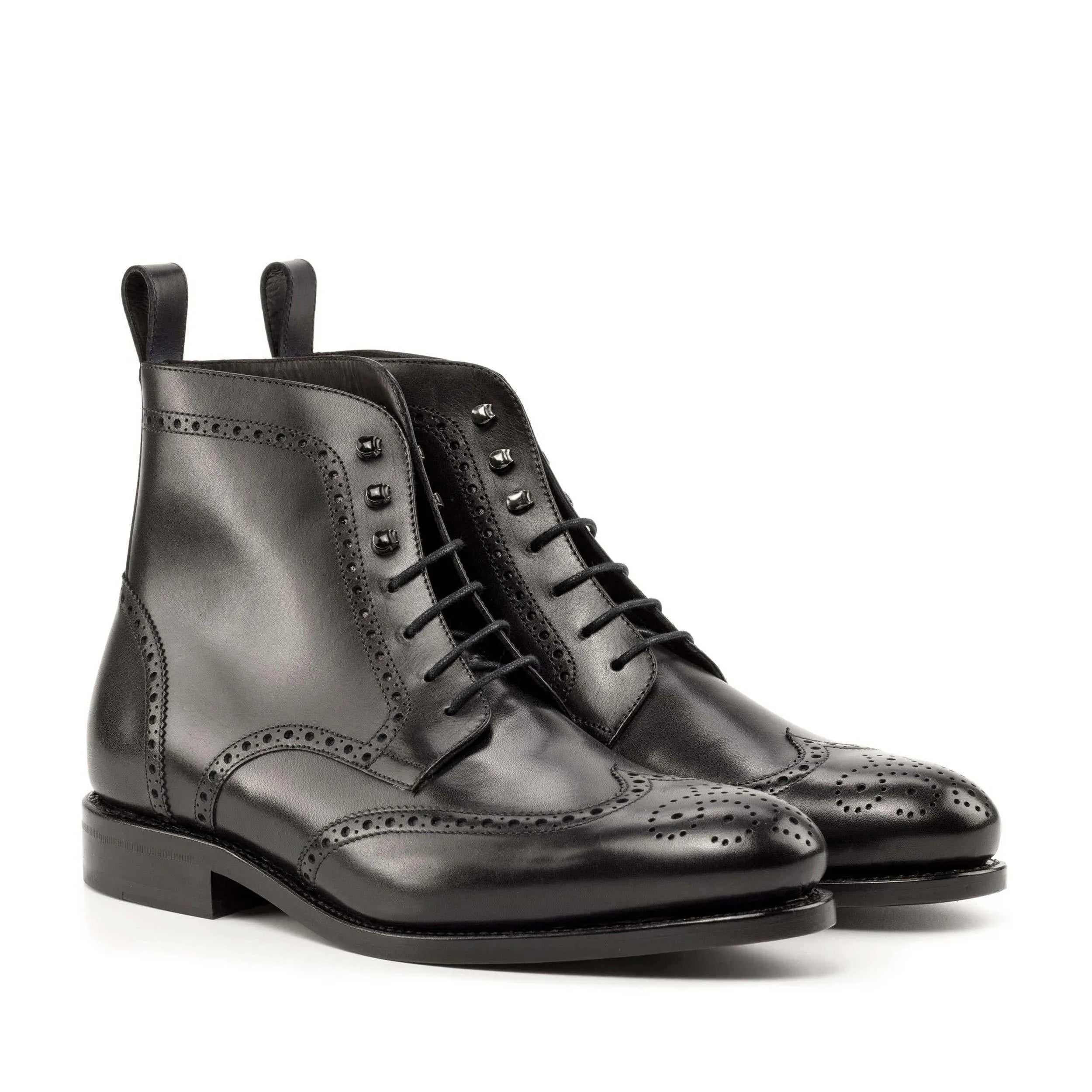 Black leather wingtip boots, featuring the Luis Military Brogue design for stylish durability