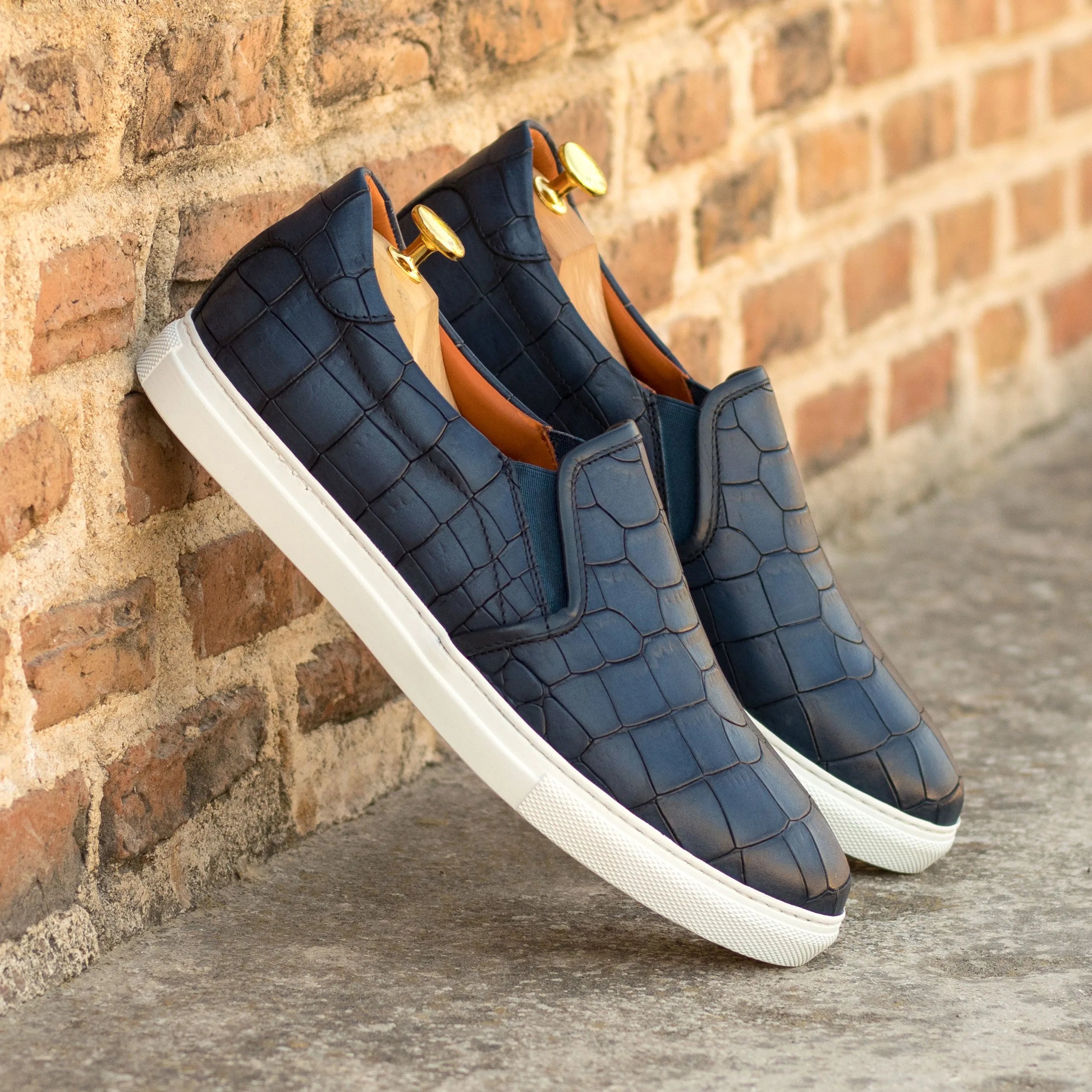 Pair of Marlos slip-on sneakers in blue crocodile pattern, luxury bespoke shoes for men