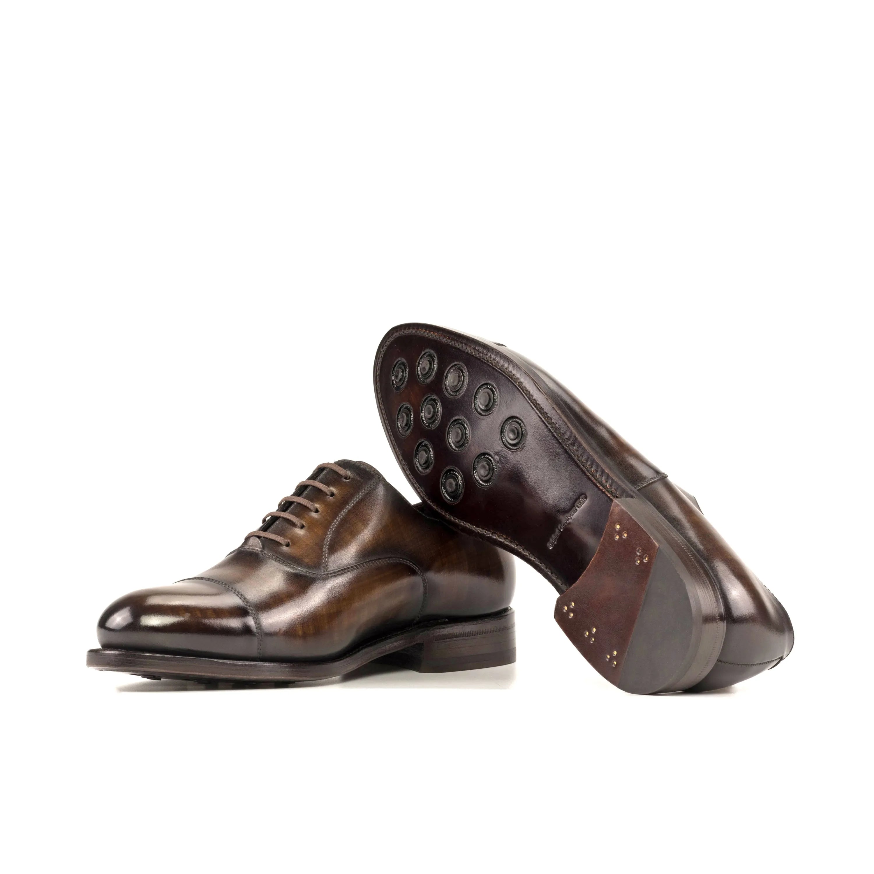 Pair of brown leather Mavrick Patina Oxford shoes showcasing elegant craftsmanship
