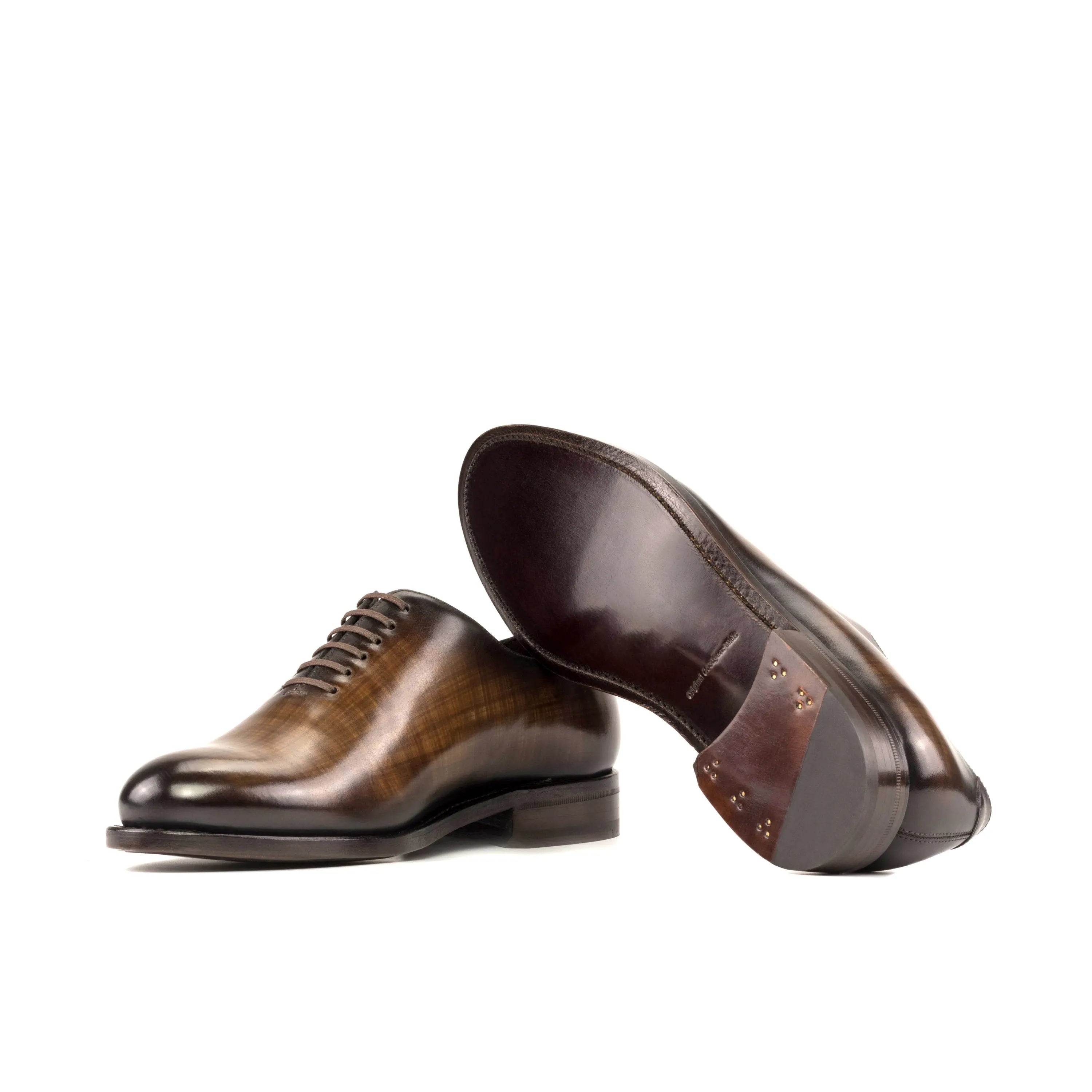 Pair of brown leather Mozart Patina Wholecut shoes showcasing elegant craftsmanship