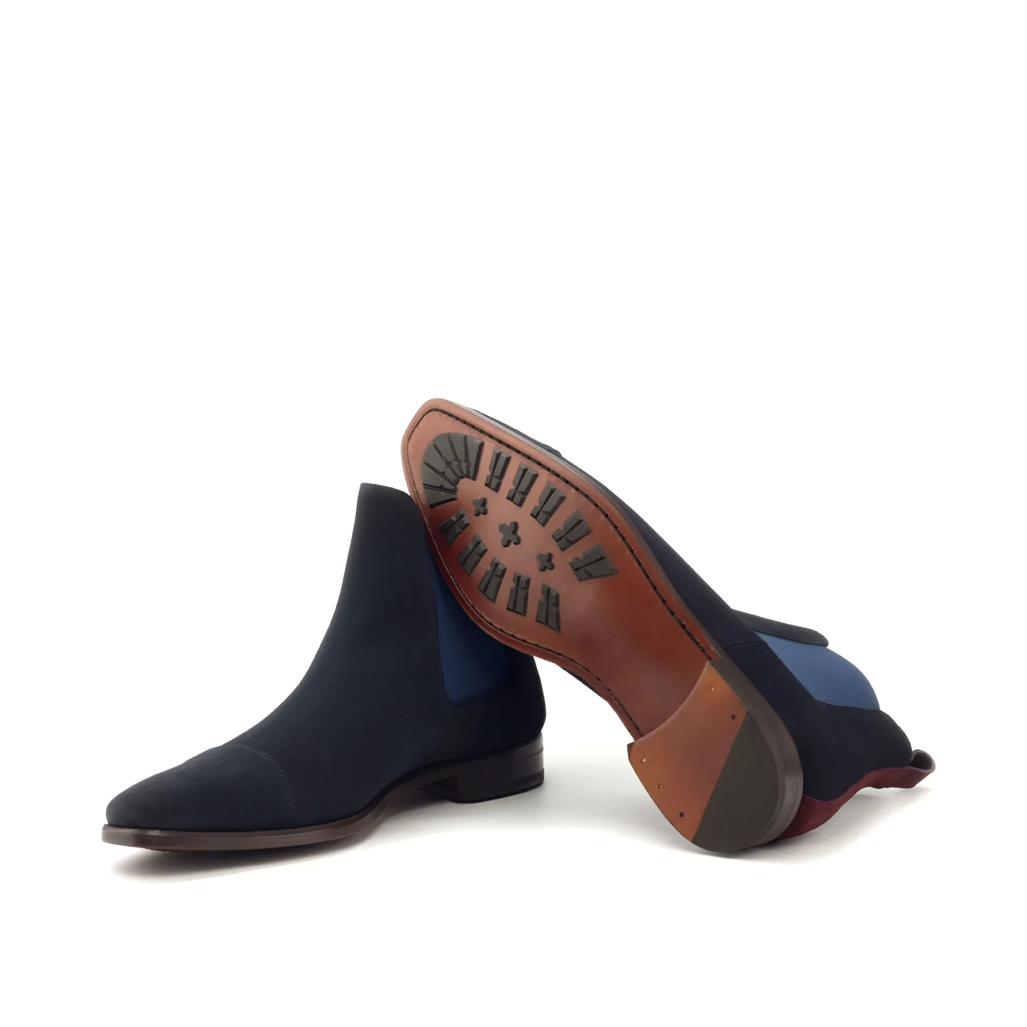 Navy suede Musko Chelsea boot with brown leather sole and heel counter