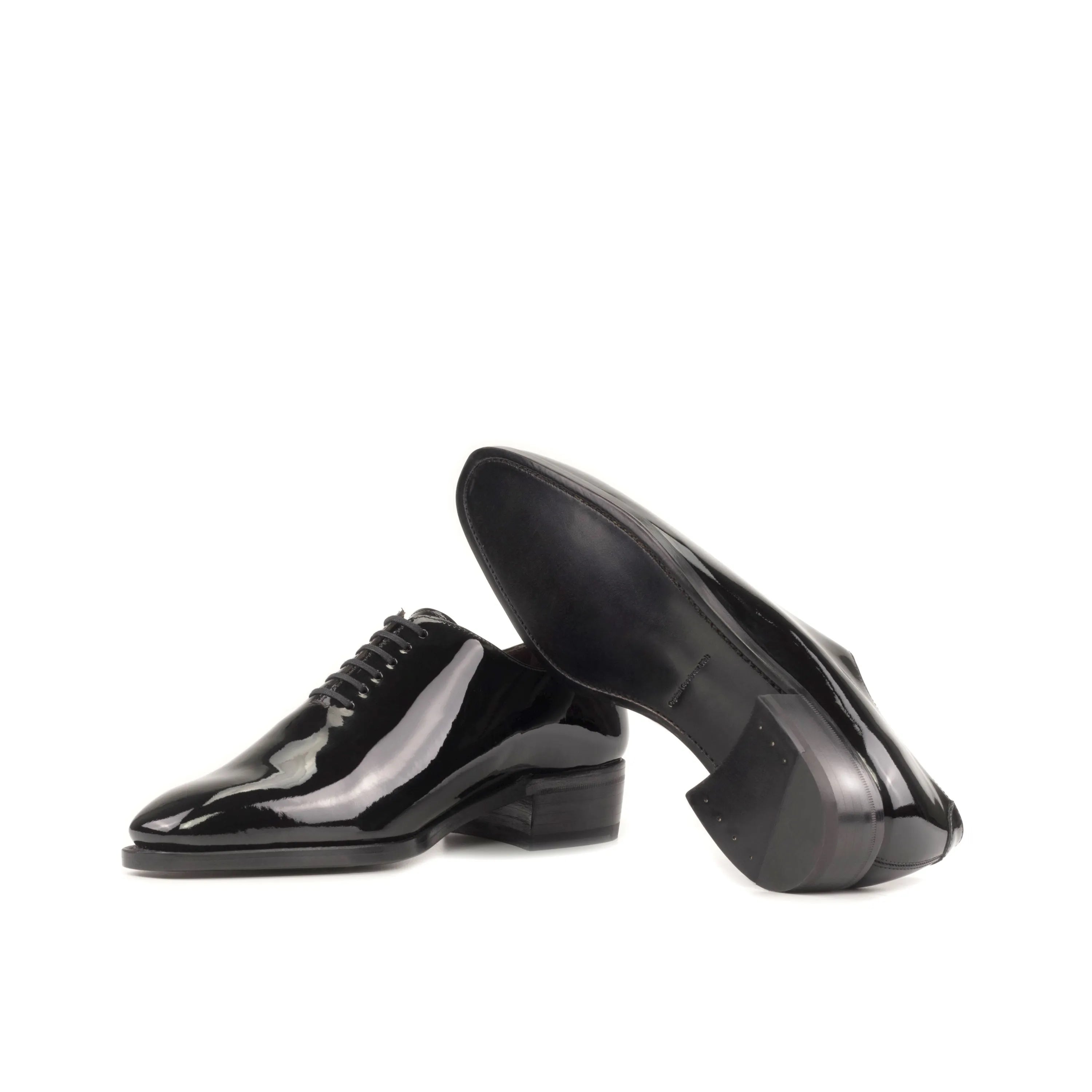 Pair of shiny black Narciso Wholecut shoes for formal and elegant occasions
